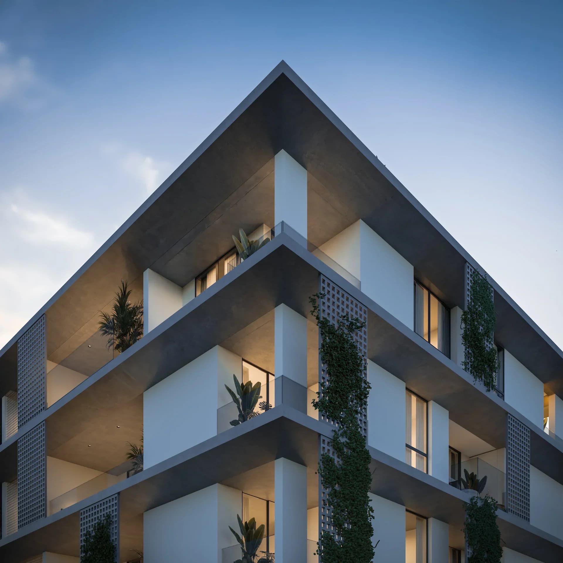 Corner of AURA with deep white balconies, climbing plants and a perforated screen