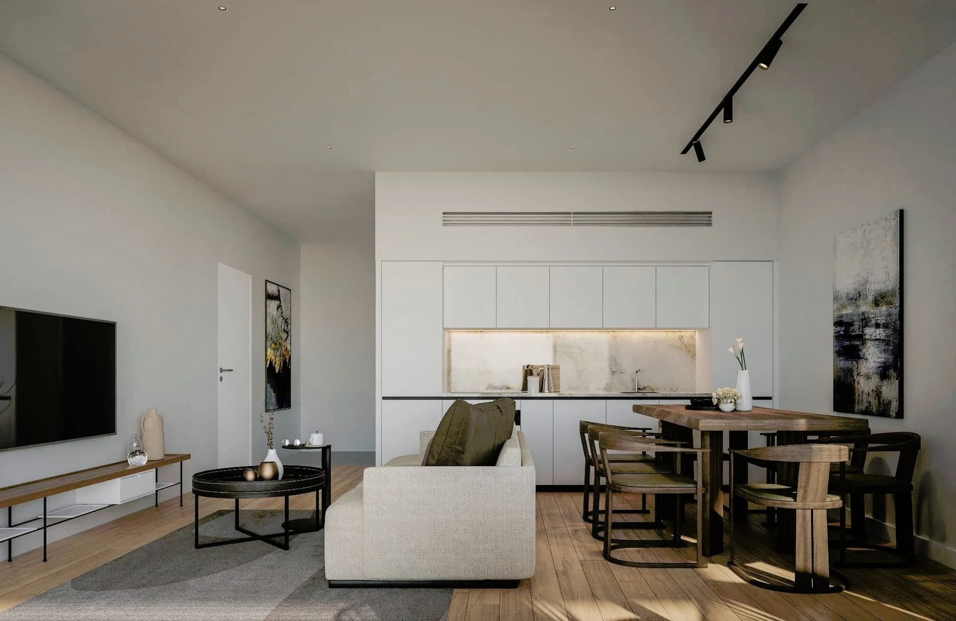 AZOR open-plan living and dining room with a white kitchen wall