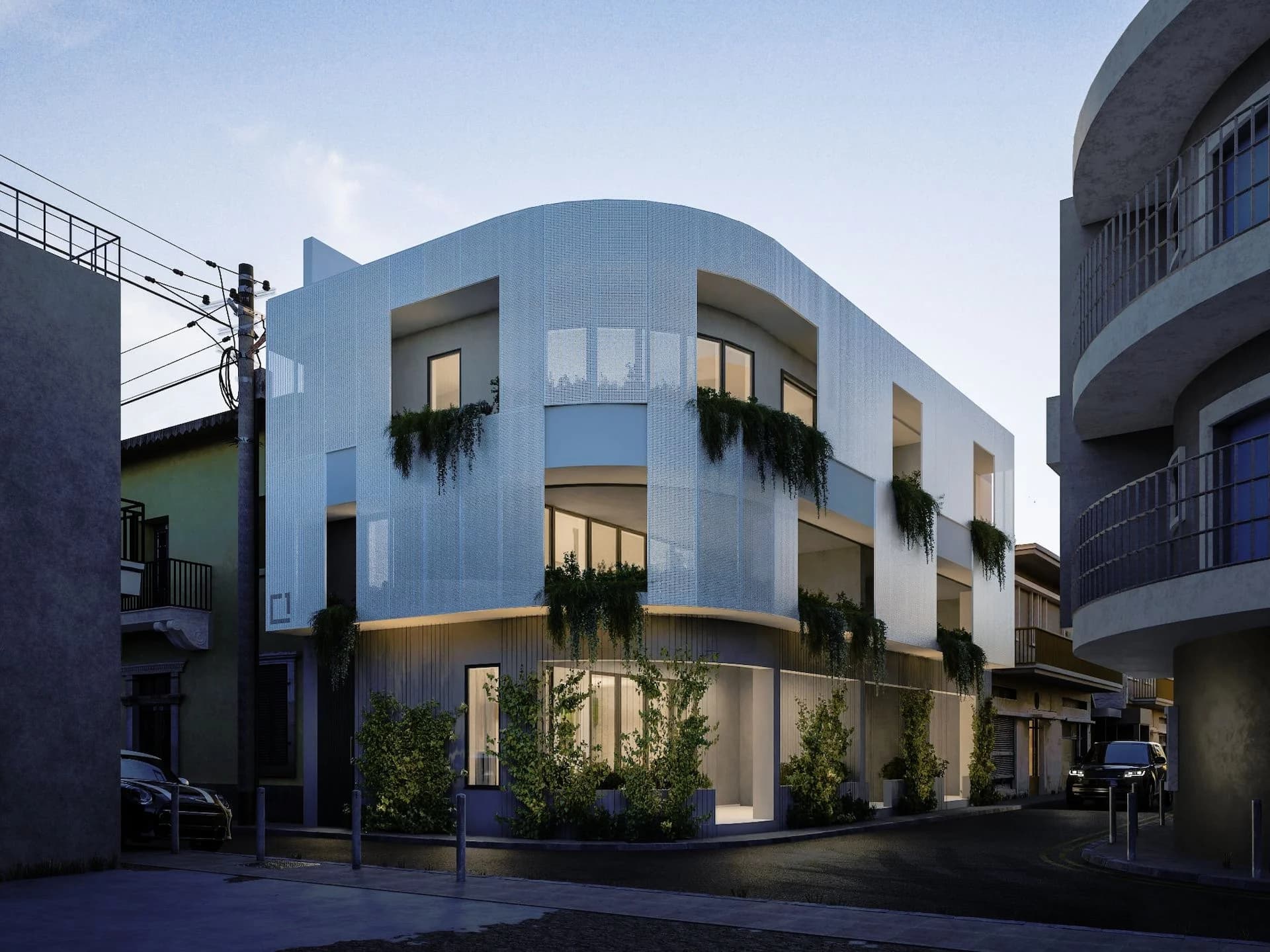 HARLIR at dusk, its curved facade lit above the street