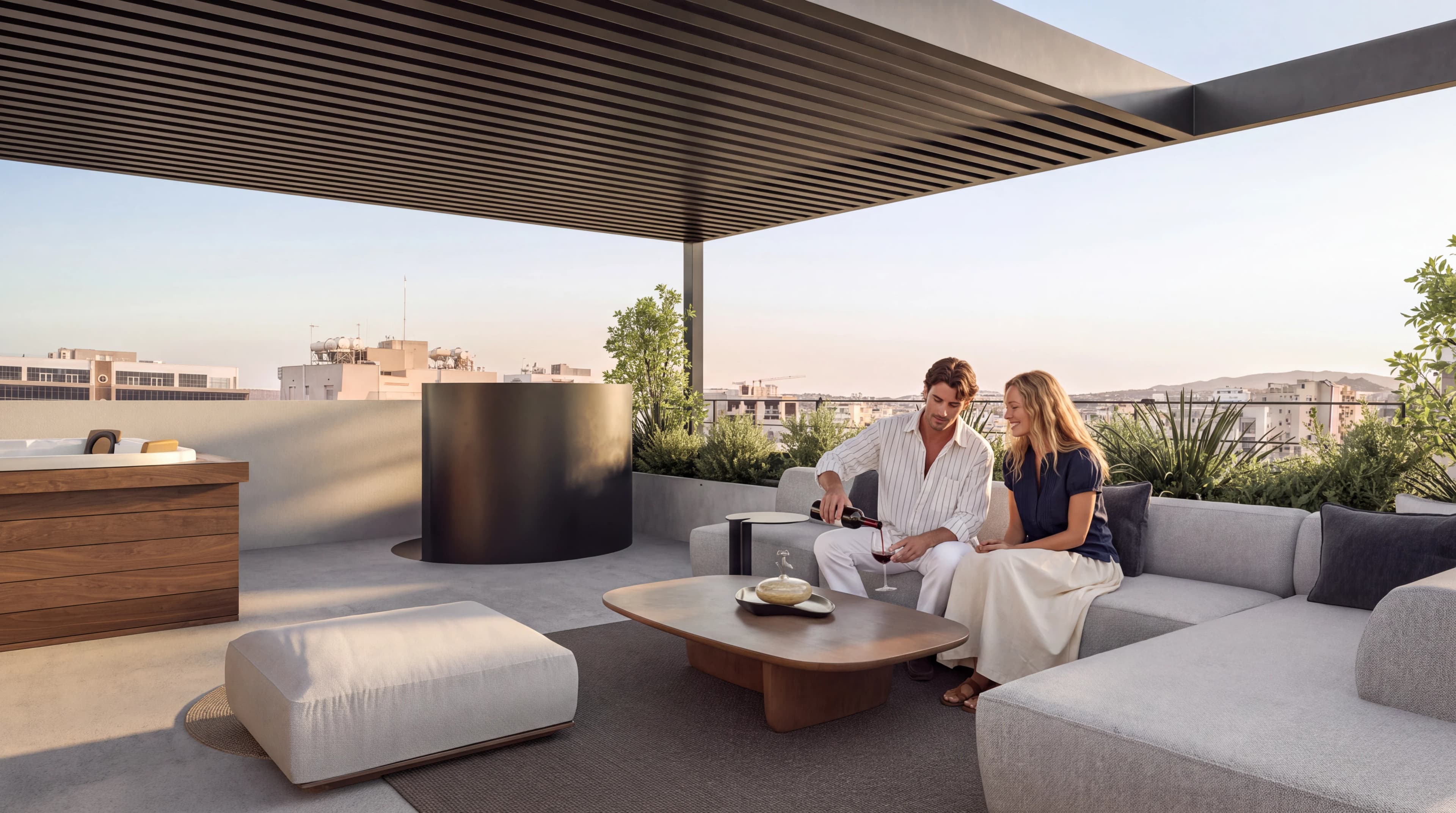 Couple relaxing in IRIS's shaded roof terrace lounge above central Limassol