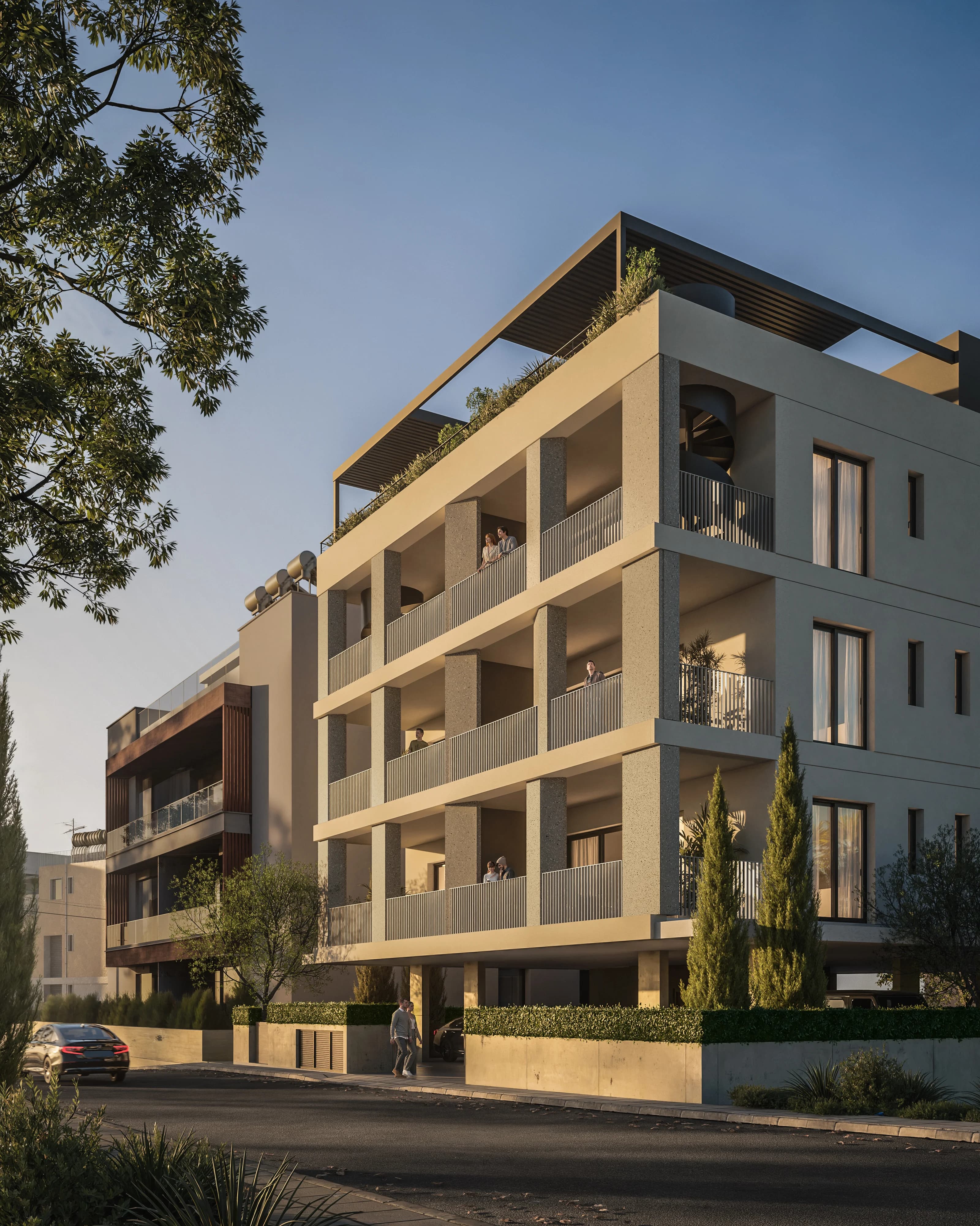 IRIS's stone-clad facade with deep balconies and a planted roof edge, seen from the street