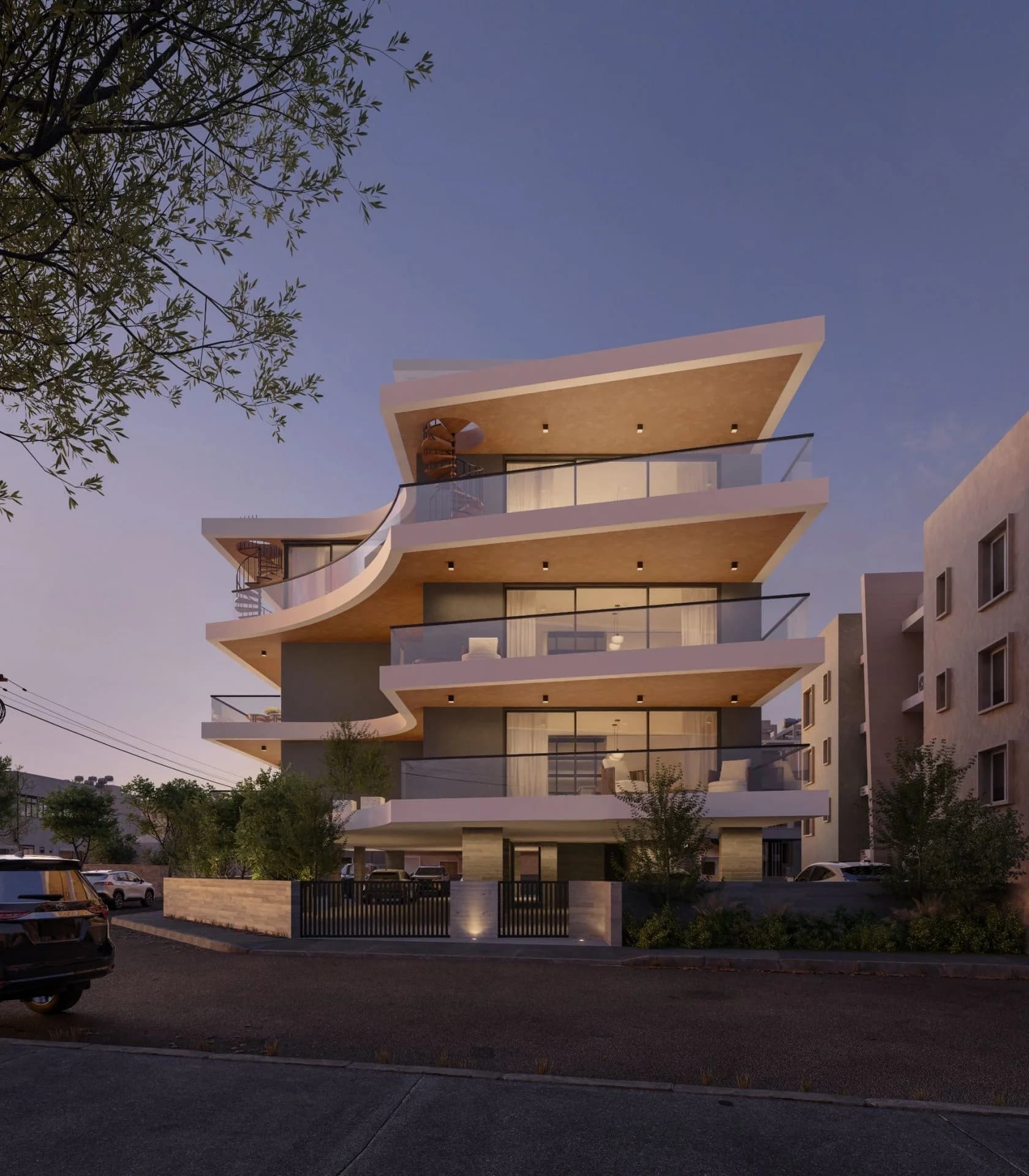KABU's sweeping curved balconies glowing at dusk