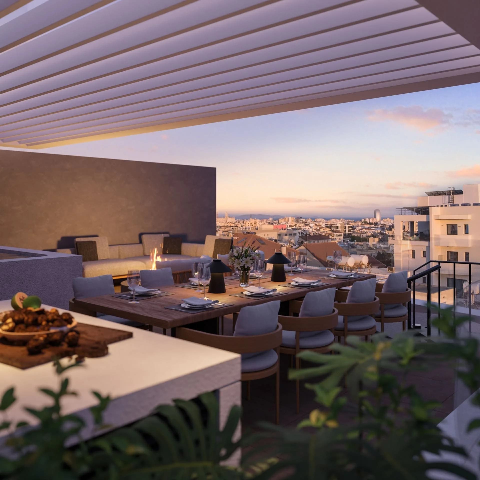 KABU roof terrace dining table at dusk, looking over Limassol's rooftops