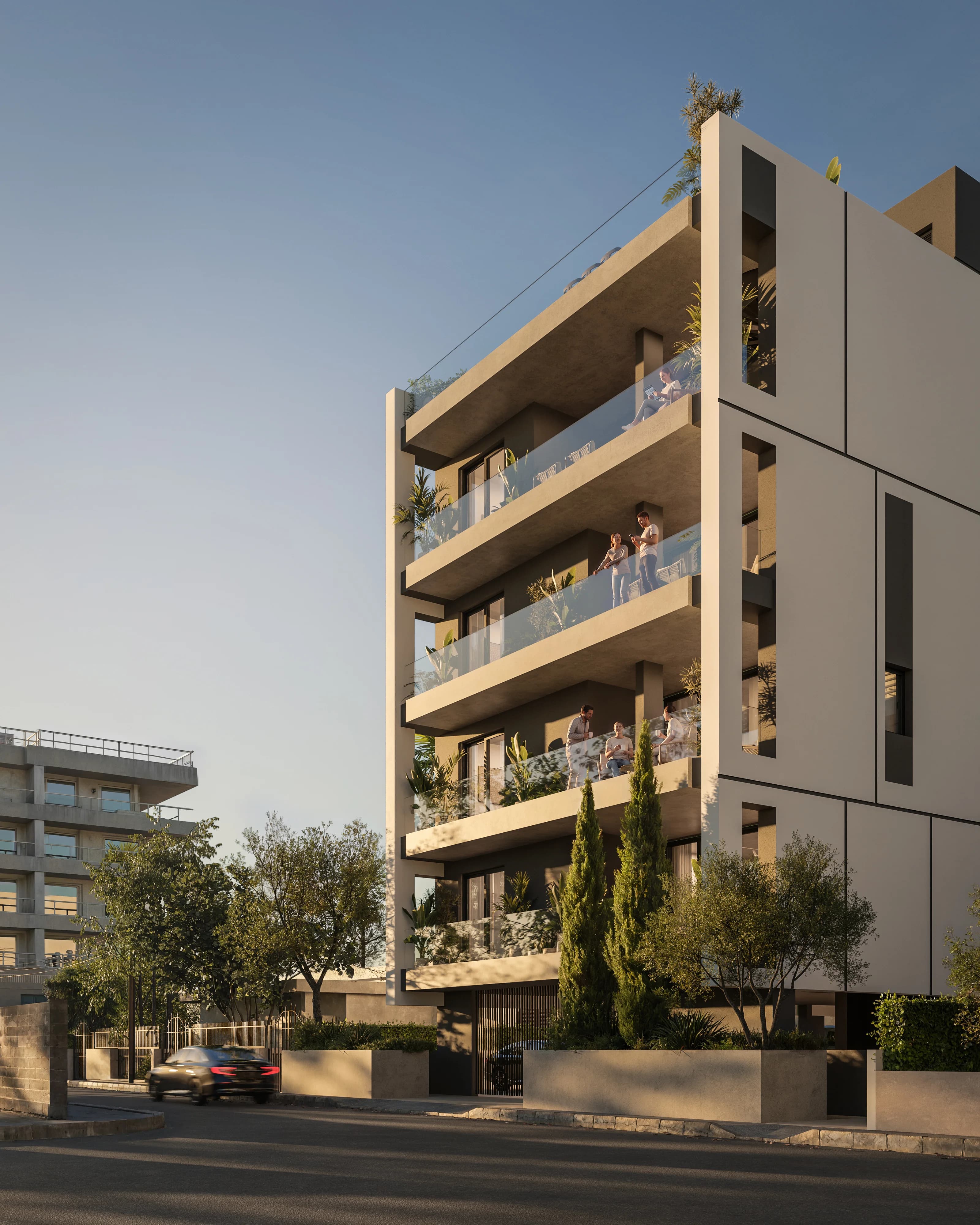 KAI's slim white building with glass balconies, residents out on the upper floors