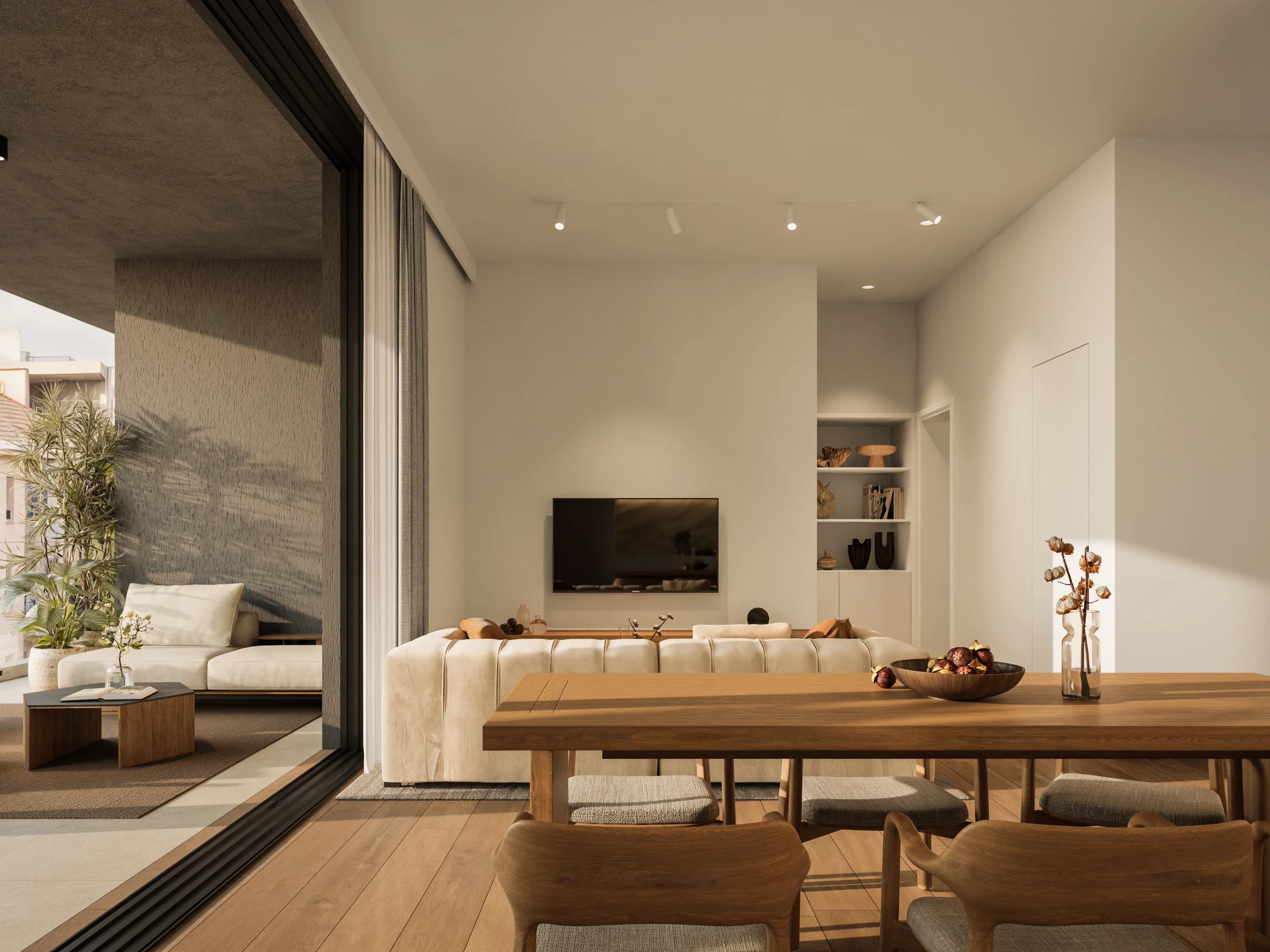 KAI living and dining area opening onto a planted veranda