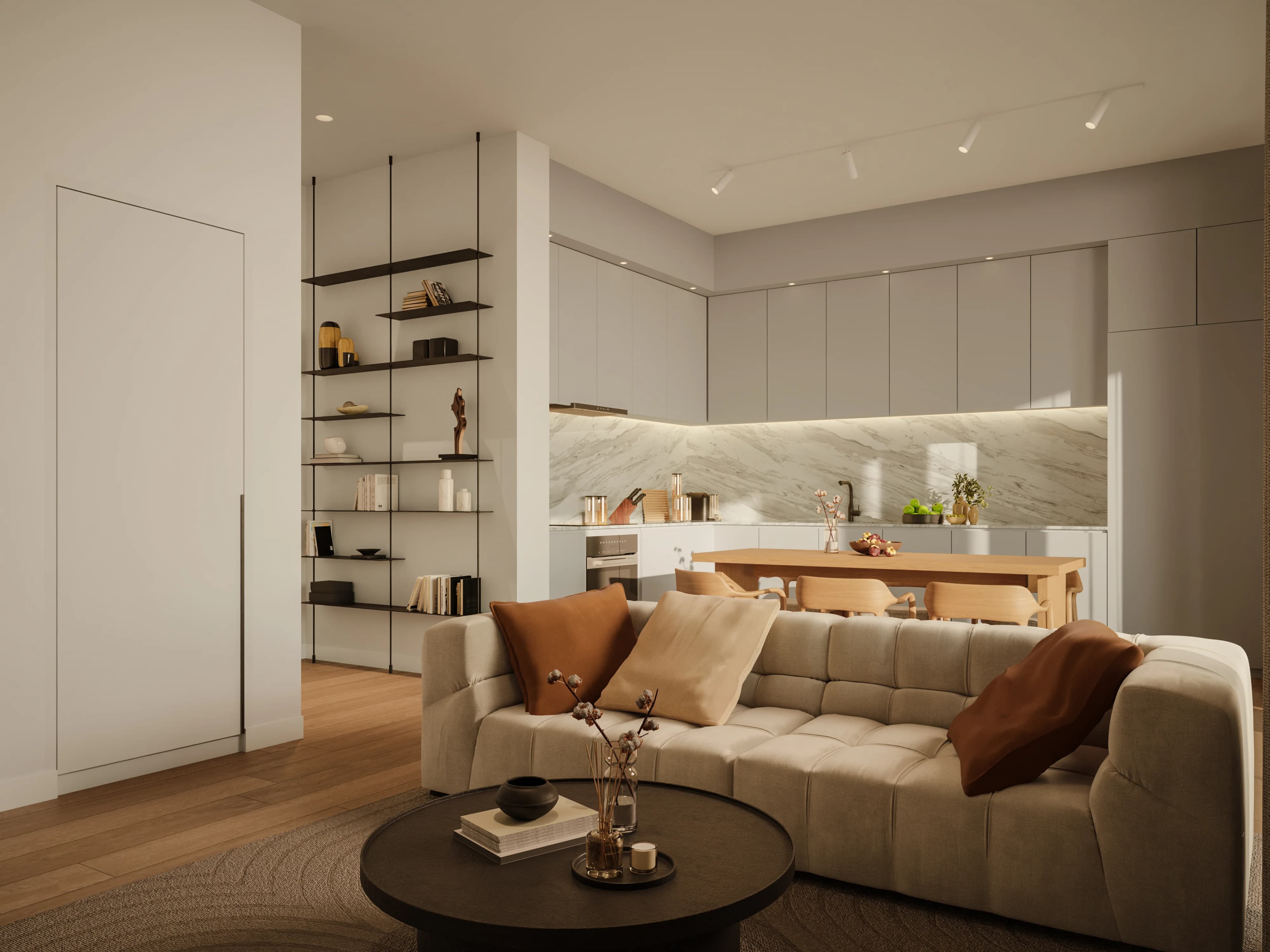KAI living room with a deep sofa, open shelving and a marble-backed kitchen