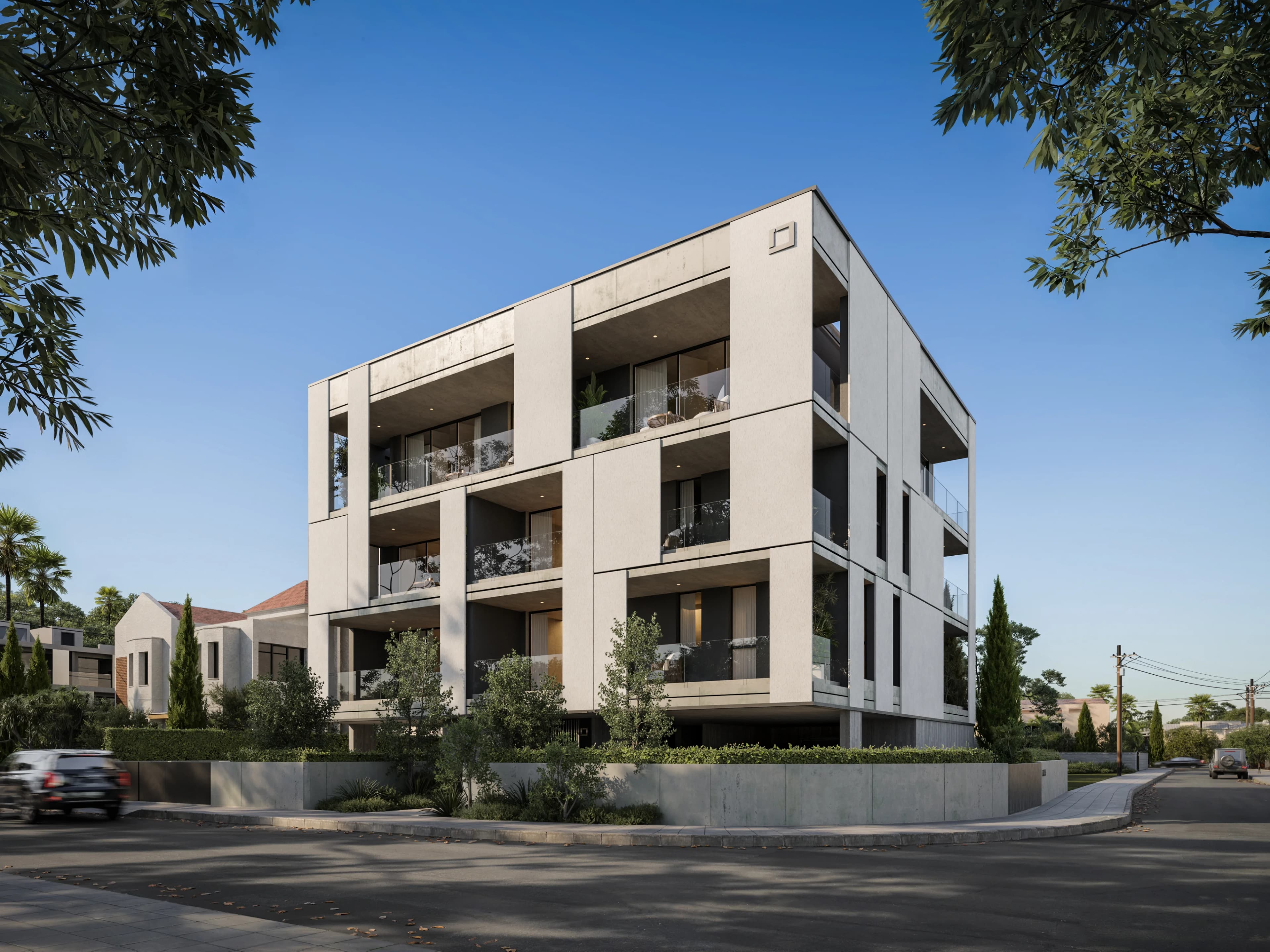 KAIA's white block with framed balconies on a quiet corner in Germasogeia
