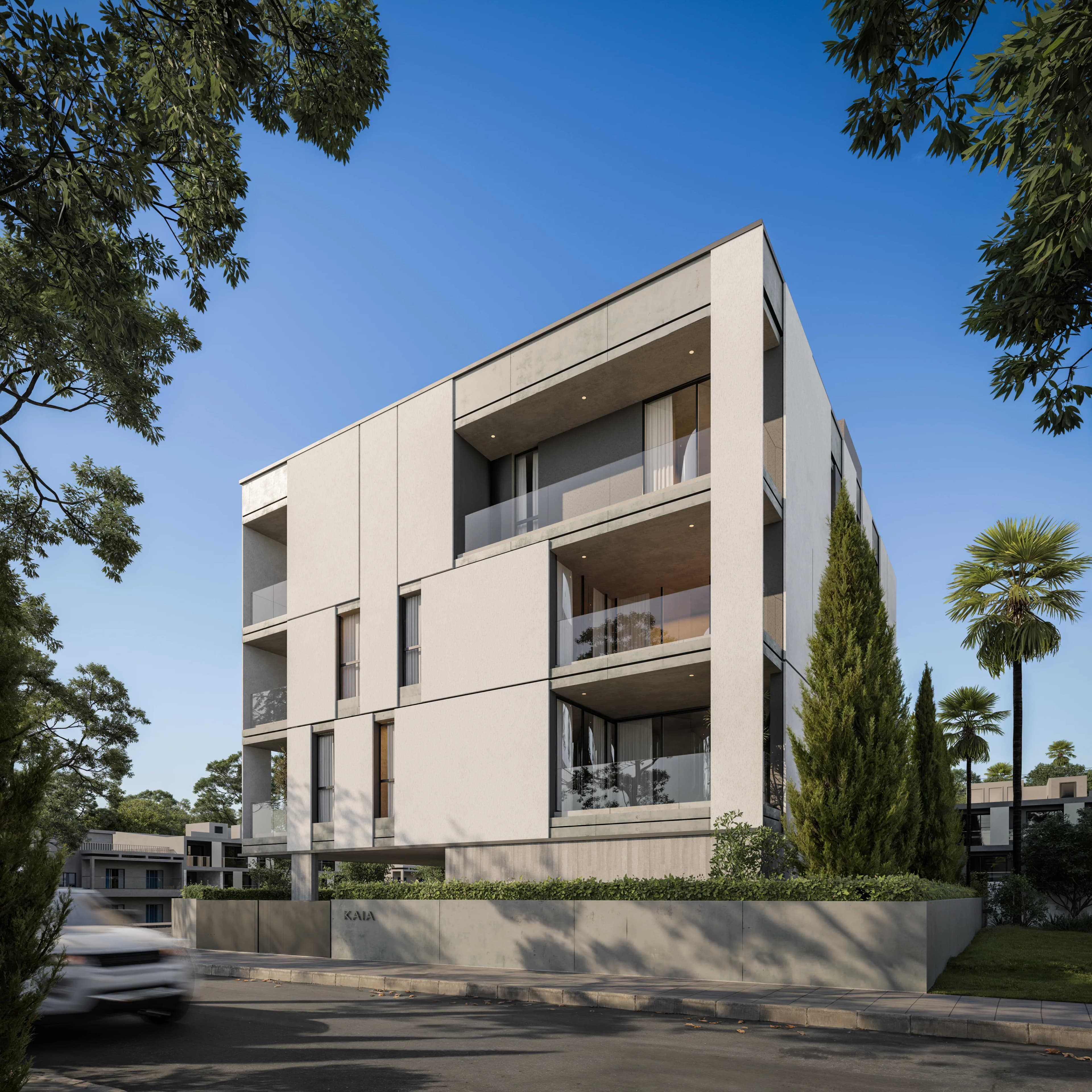 KAIA's balconies with glass railings among palms and cypress trees