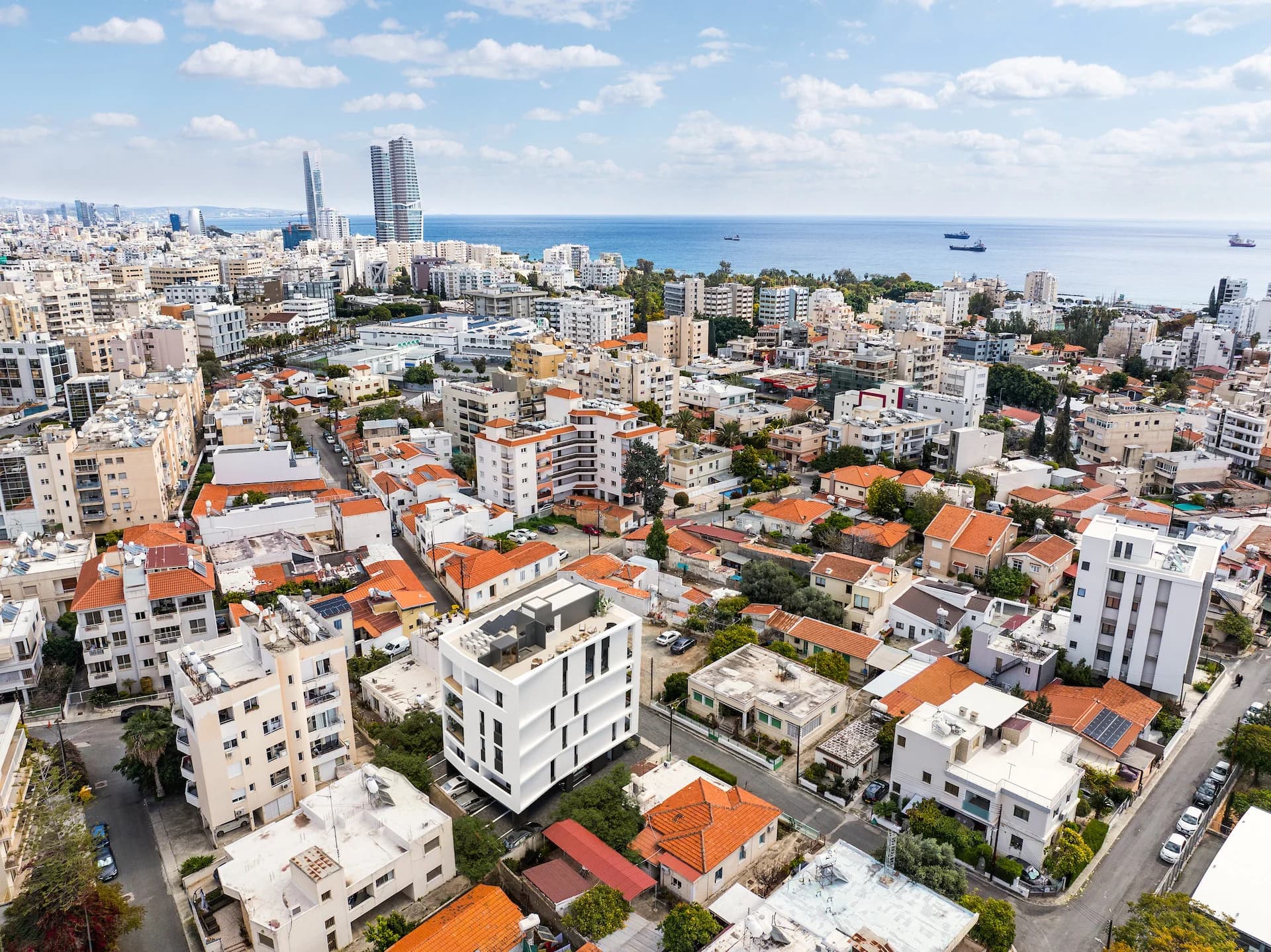 Aerial view of LAV in central Limassol, the old town running down to the sea and the towers