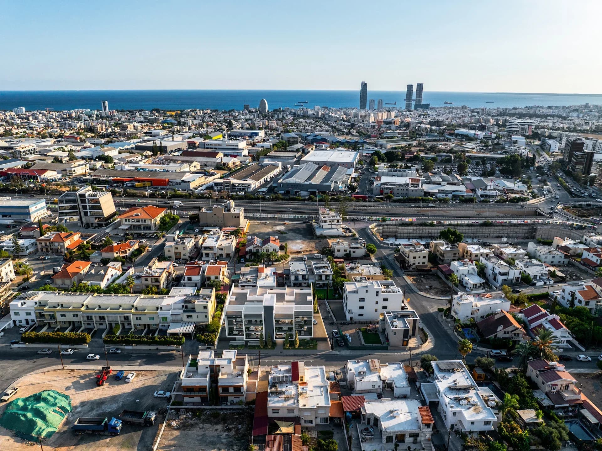 Aerial view over Agios Athanasios to Limassol's towers and the sea