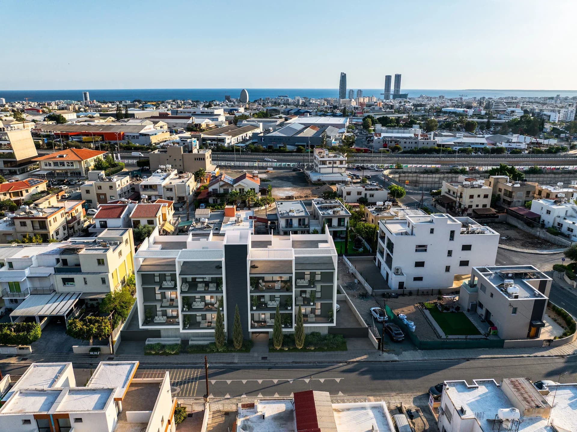 LENNOX from above, a white block among the houses of Agios Athanasios