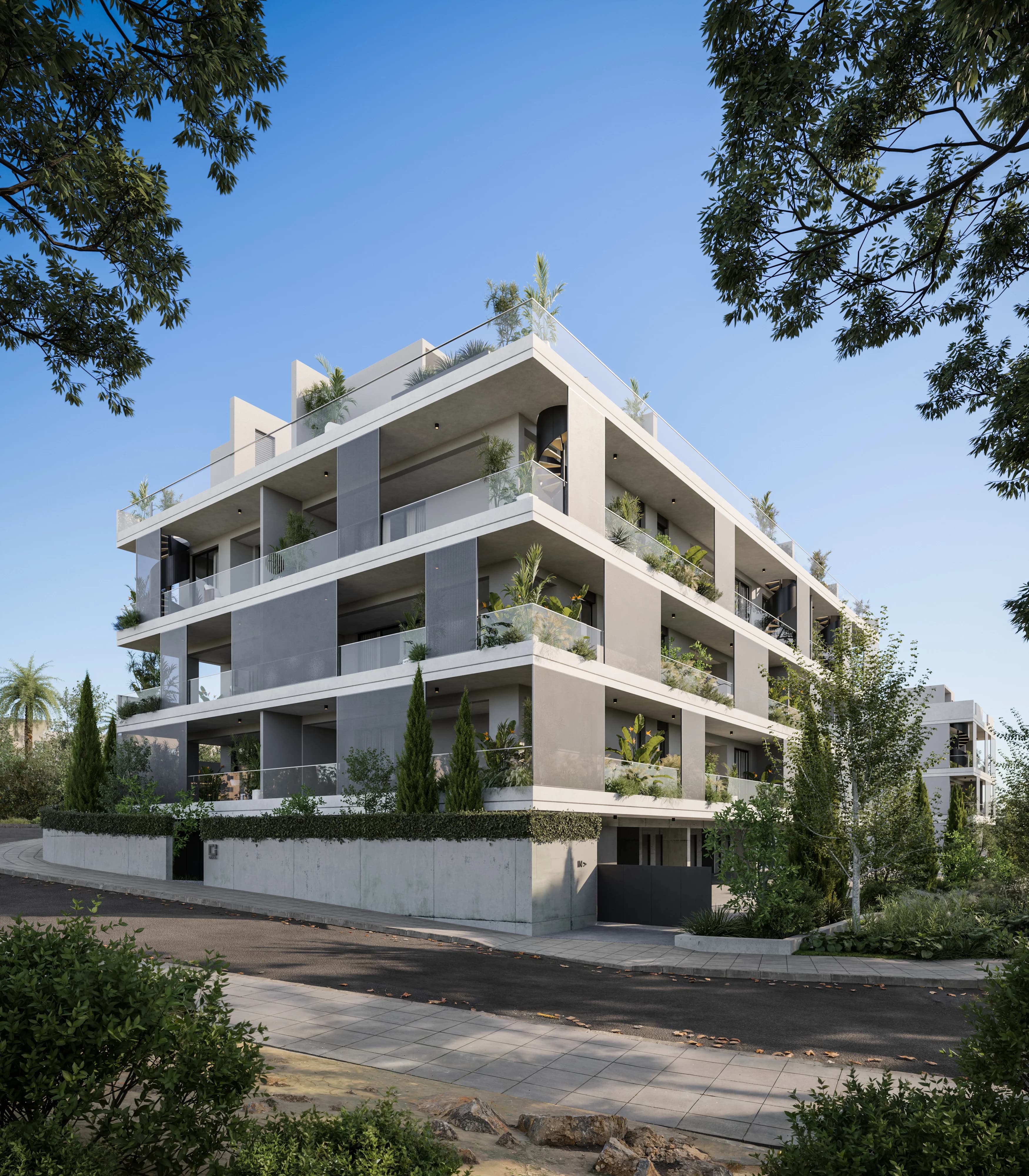 NAYA's white block with planted balconies and roof terraces among cypress trees