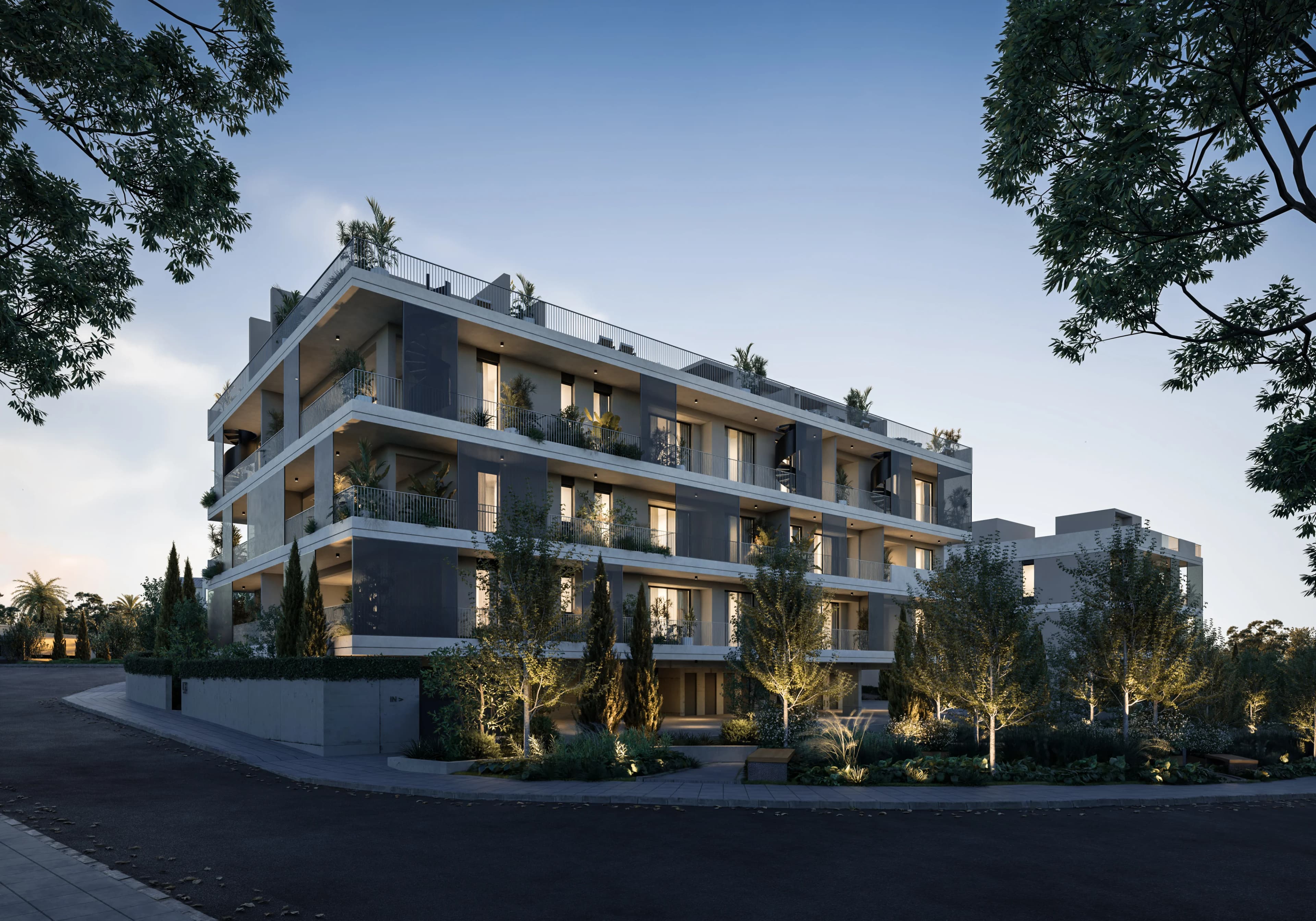 NAYA at dusk, its terraces lit above landscaped gardens