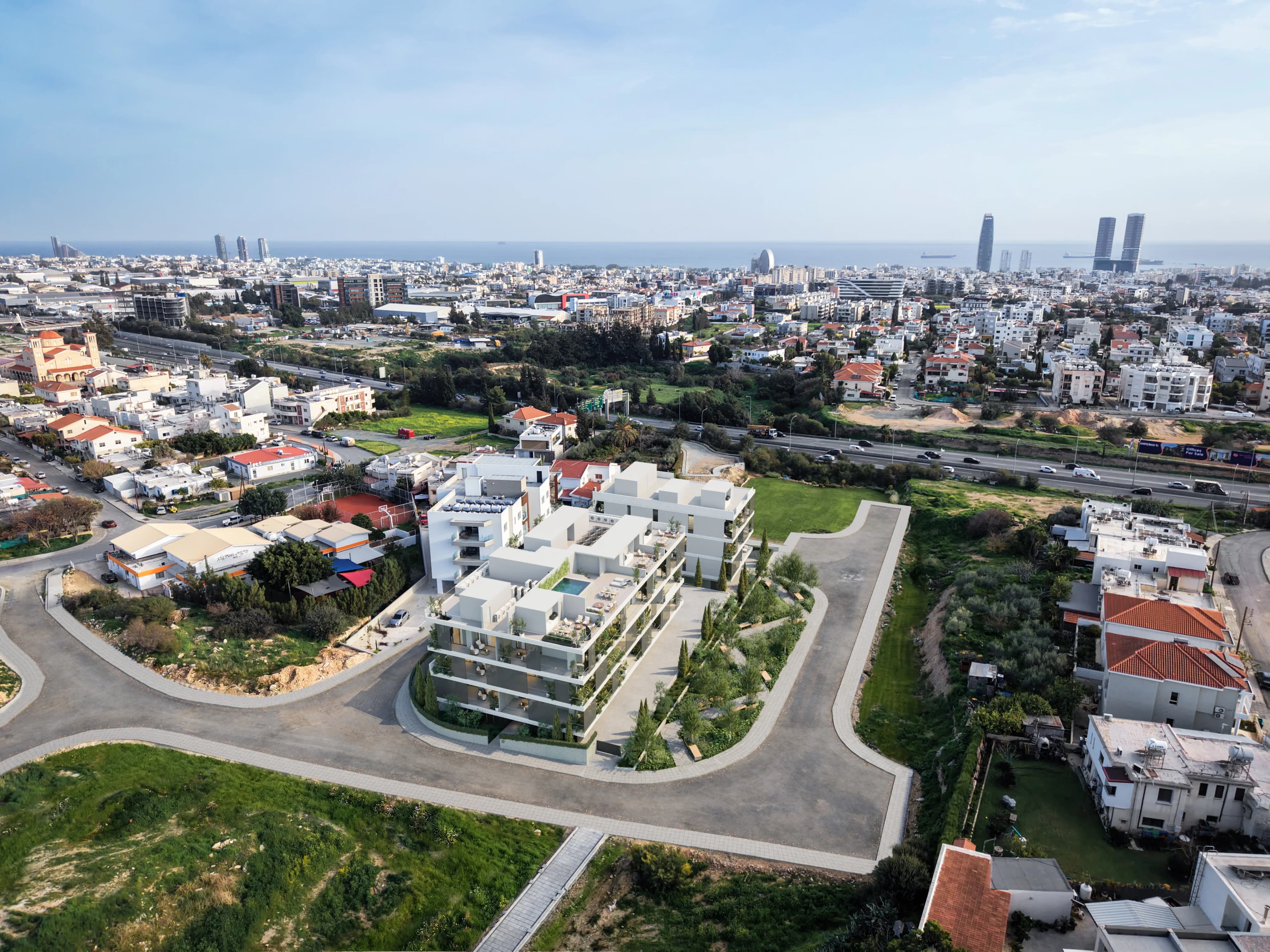 Aerial view of NAYA in Agios Athanasios, with Limassol and the sea beyond