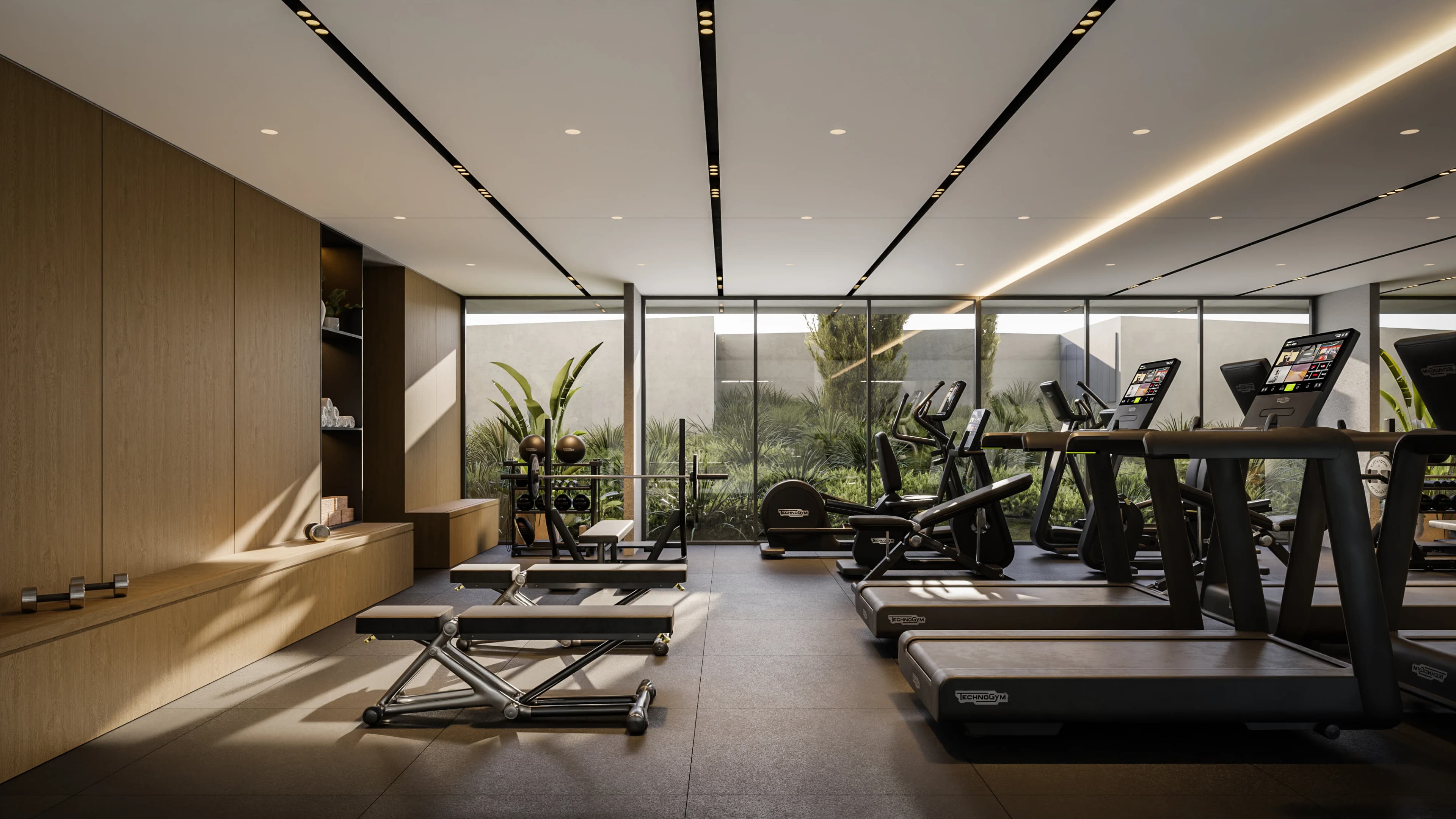 NAYA gym with treadmills facing a planted courtyard