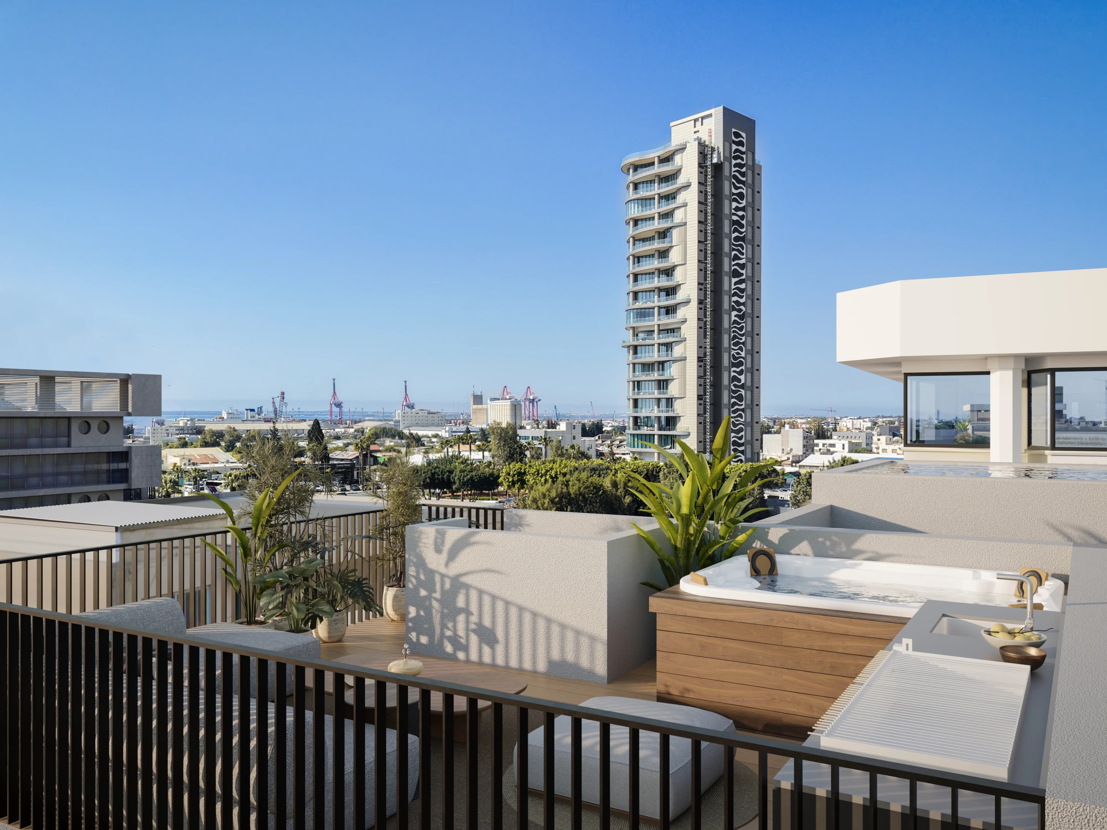 NEON's rooftop plunge pool looking out over Limassol to the port and a high-rise tower