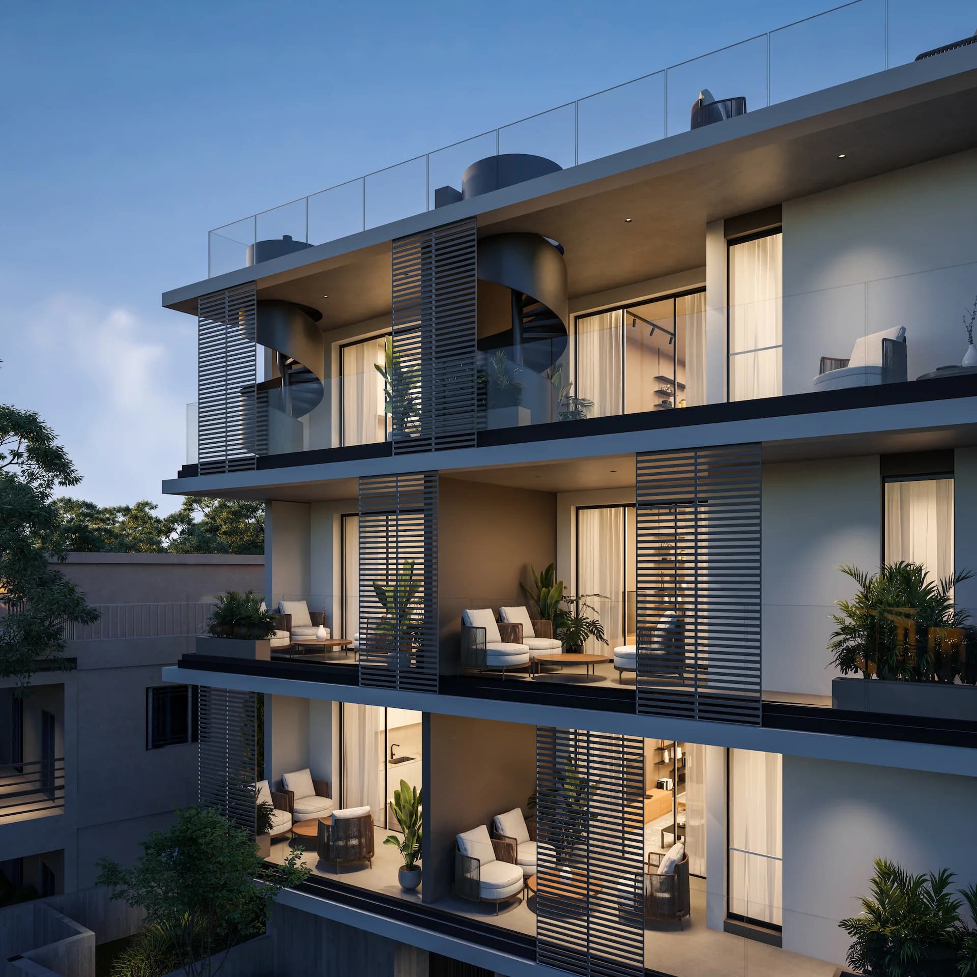 NOA balconies at dusk with a spiral stair to the roof garden