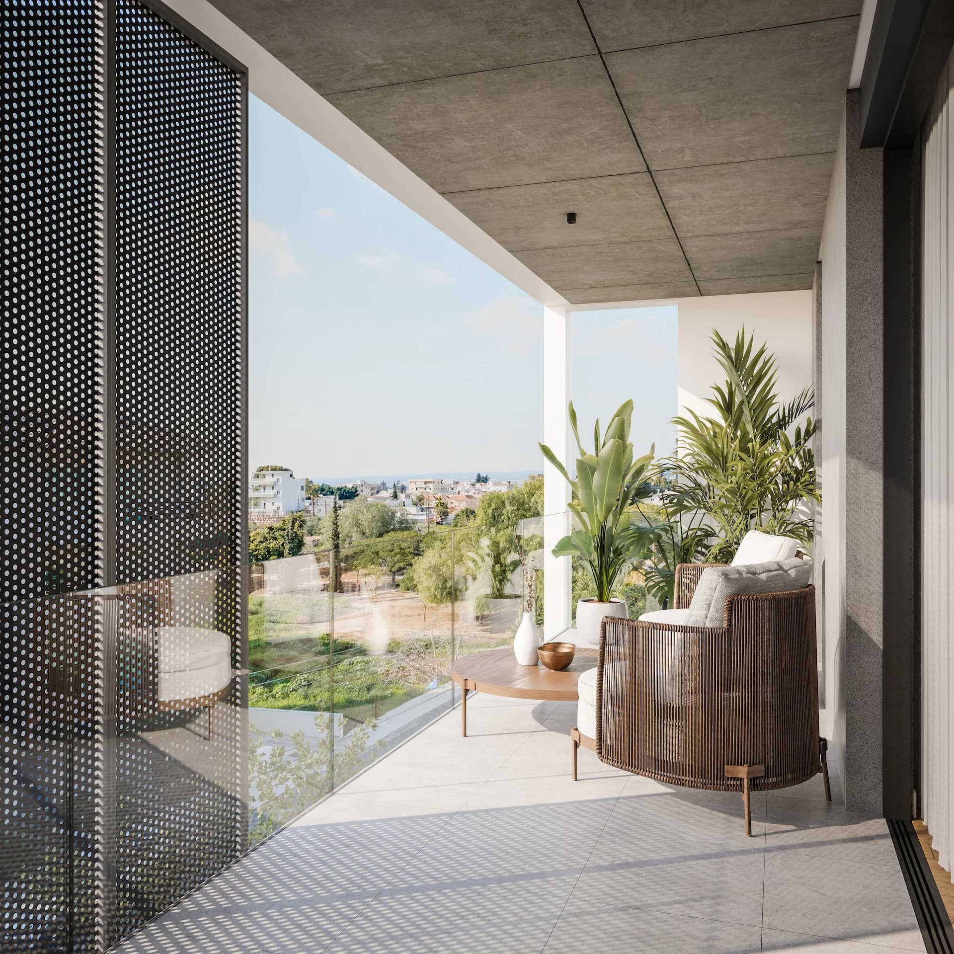 ORAMA balcony with planters looking over the trees and rooftops of Agios Nikolaos