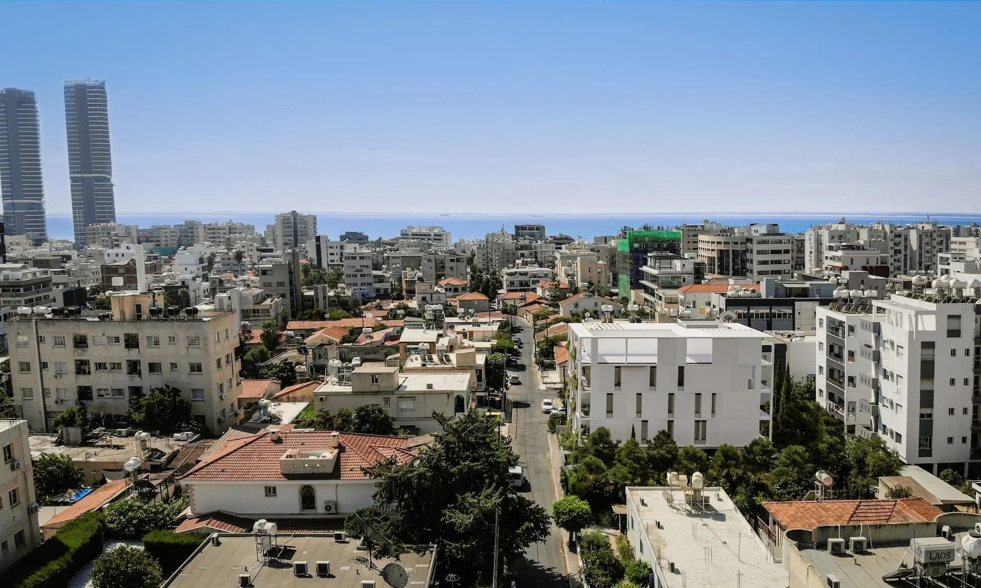 Aerial view of ORION in Agios Nikolaos, with Limassol's towers and the sea beyond