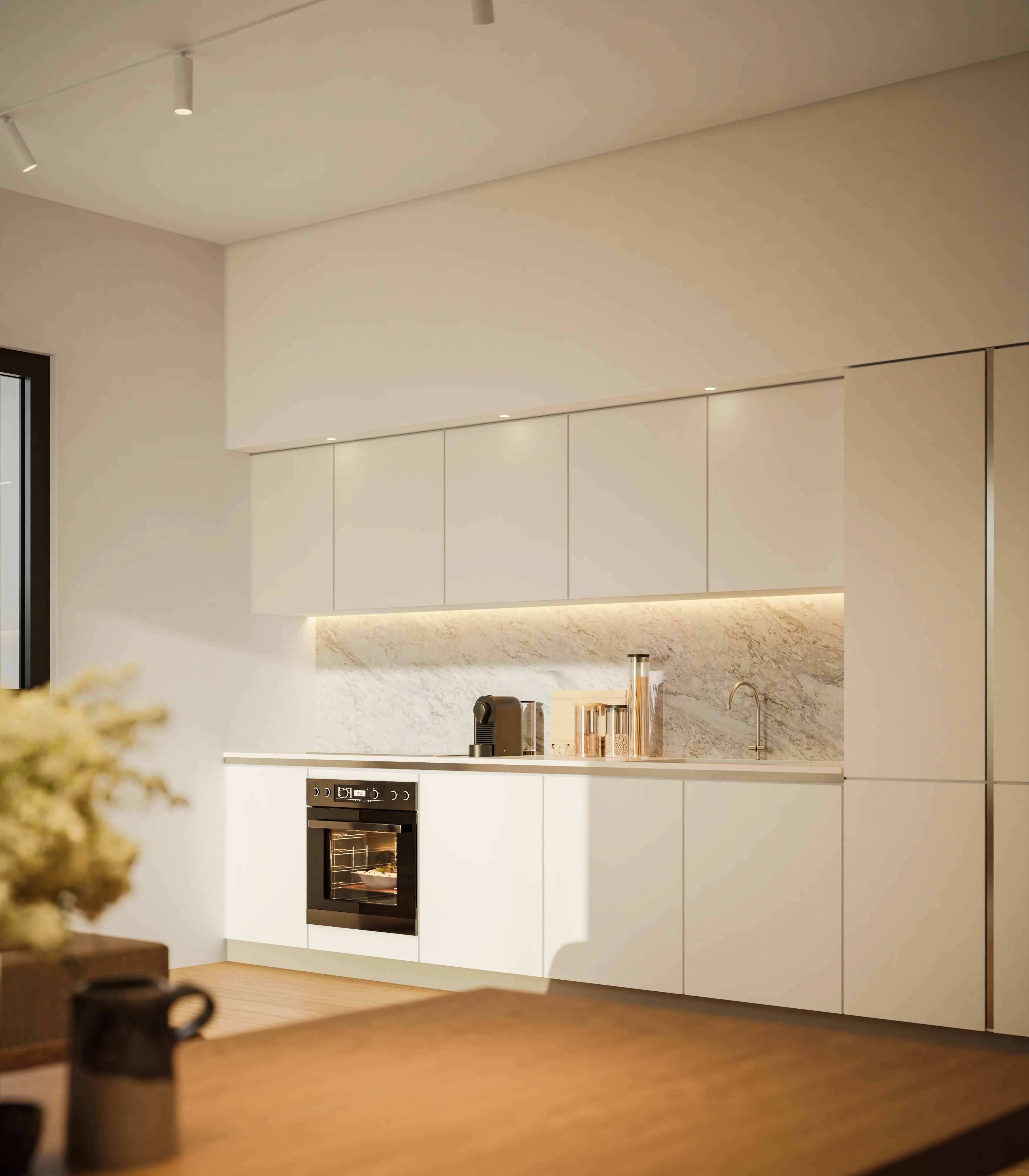 SENA kitchen with white handleless cabinets and a marble splashback