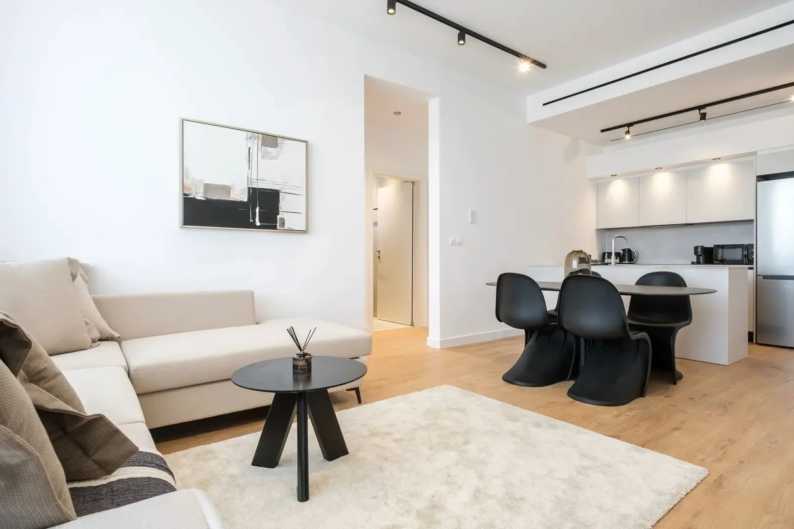 Bright SEQUOIA living room with a corner sofa and open kitchen