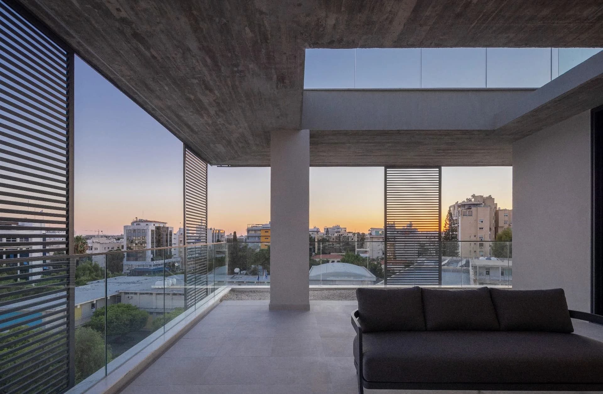 SEQUOIA covered terrace looking over central Limassol at sunset