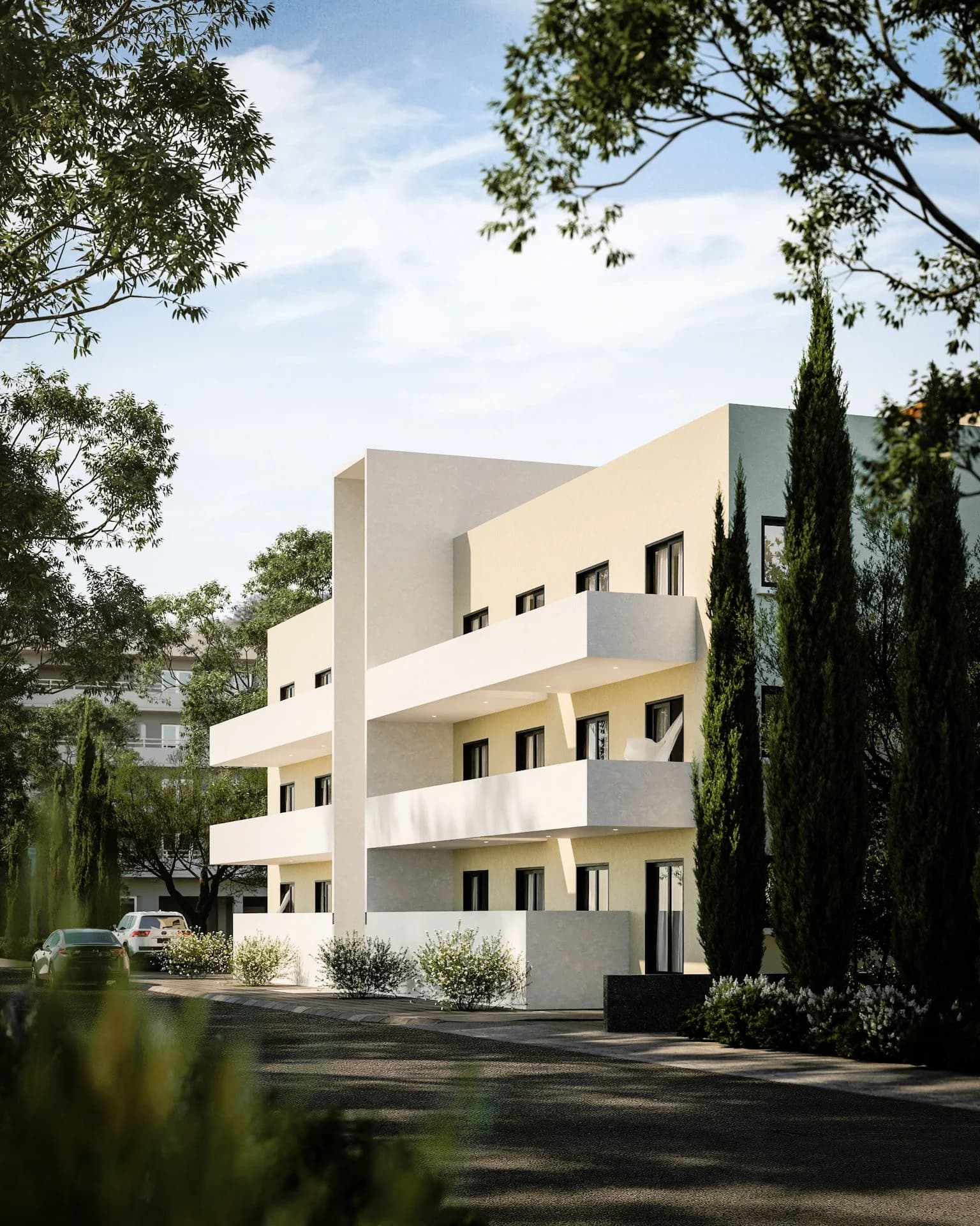 SILENE's white balconies wrapping the corner beside cypress trees