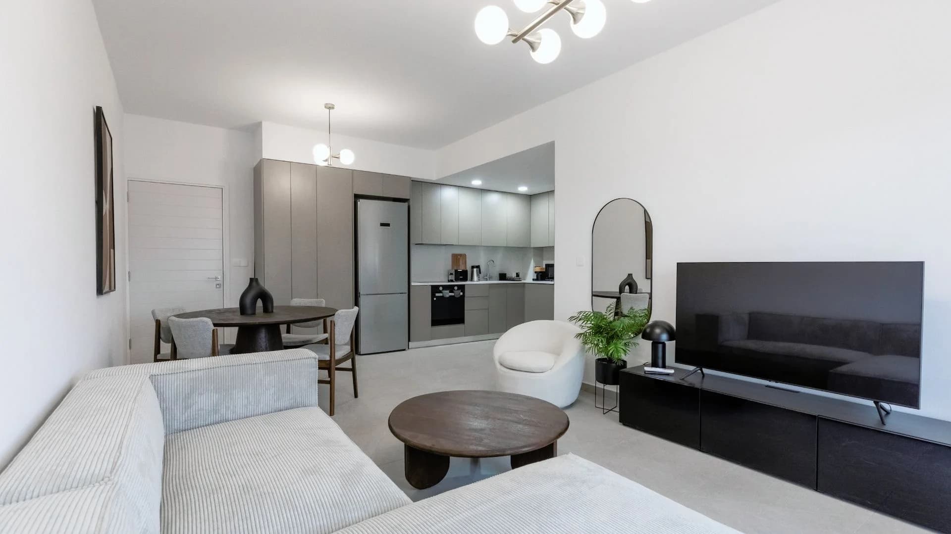 SILENE open-plan living room with a grey kitchen