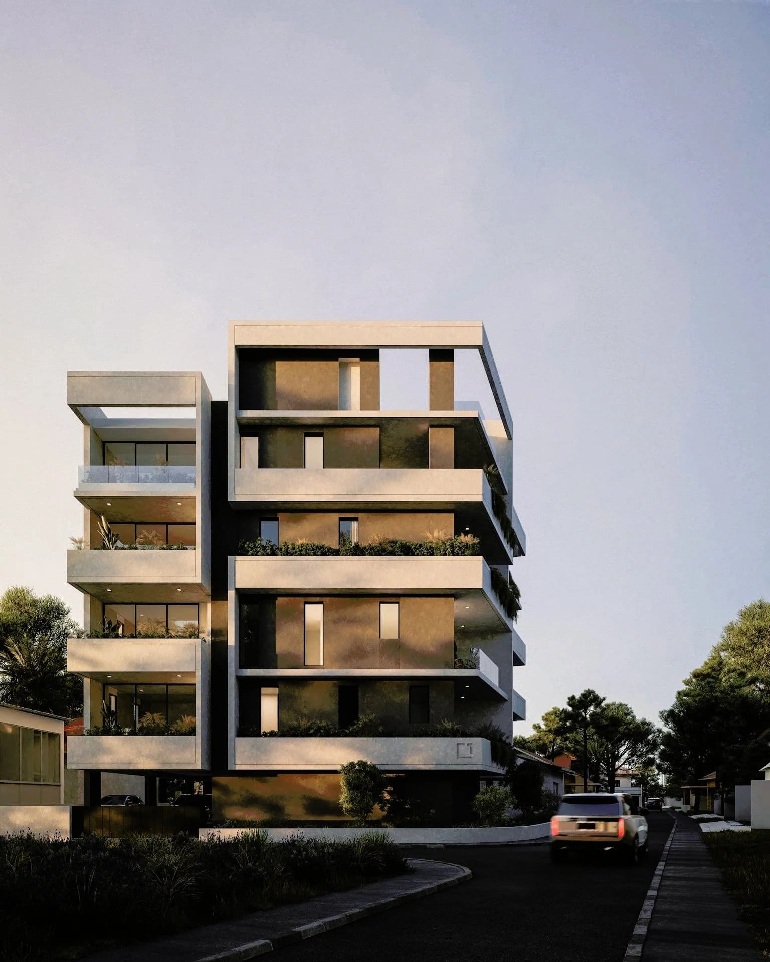 SOL's front facade with deep planted balconies in warm evening light