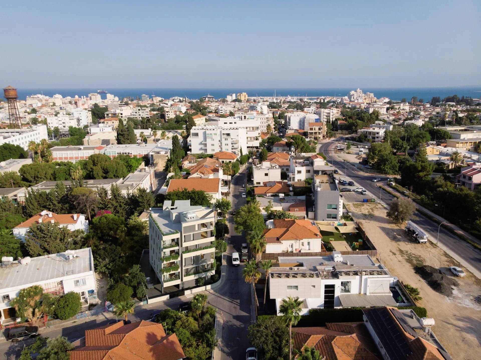 Aerial view of SOL in Katholiki, the rooftops running down to the sea