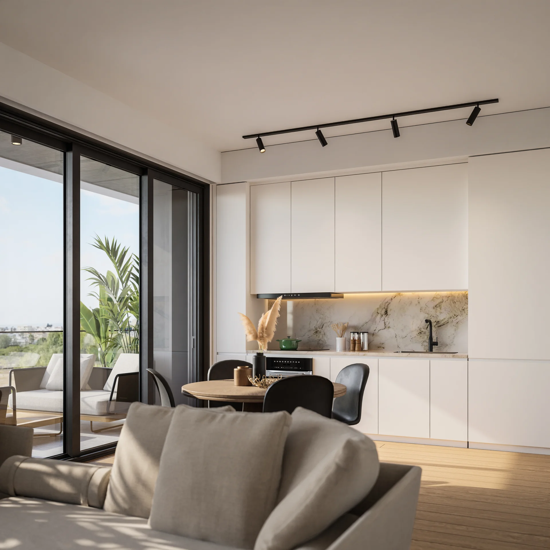SOLEA kitchen with a marble splashback and a round dining table