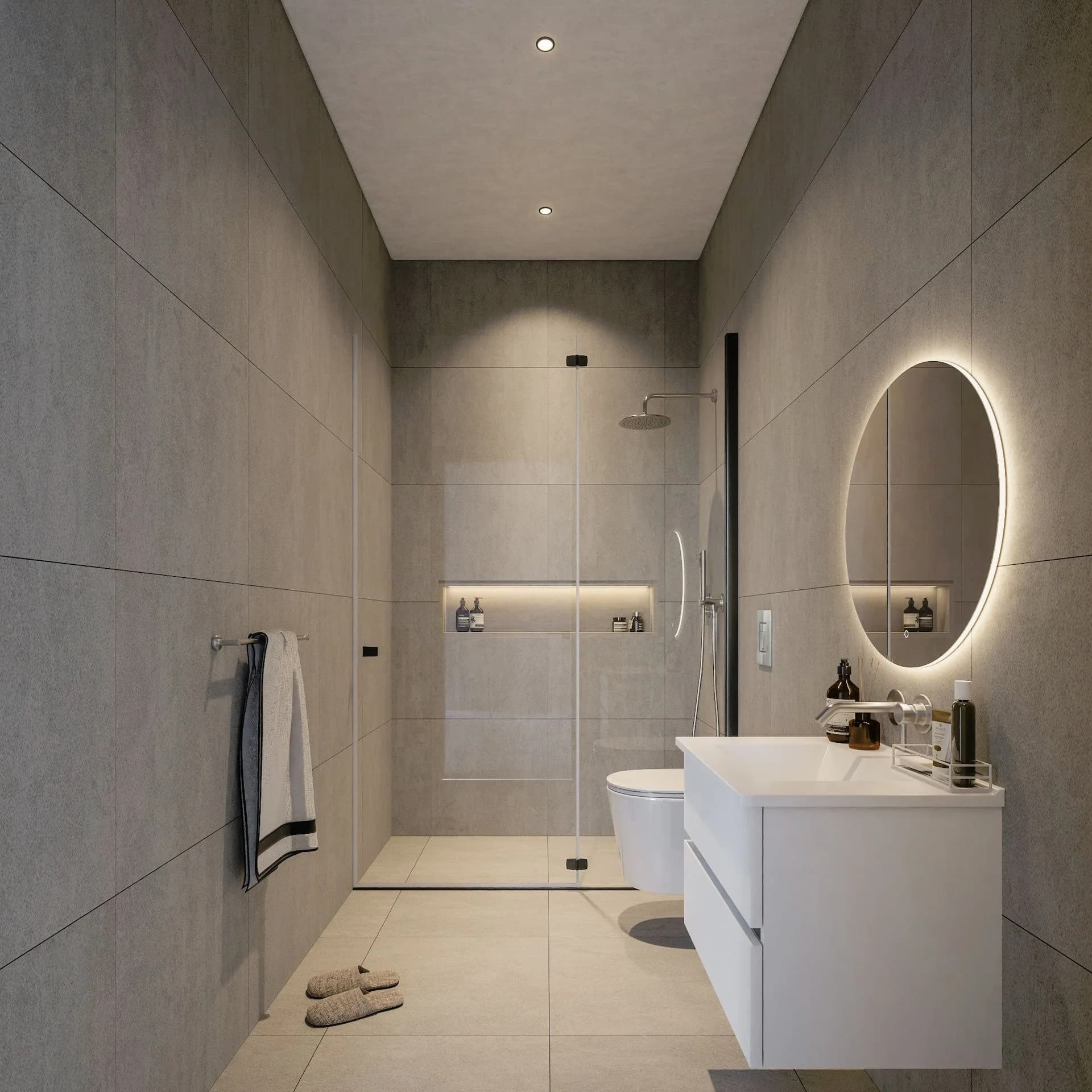 SORA shower room with a round backlit mirror
