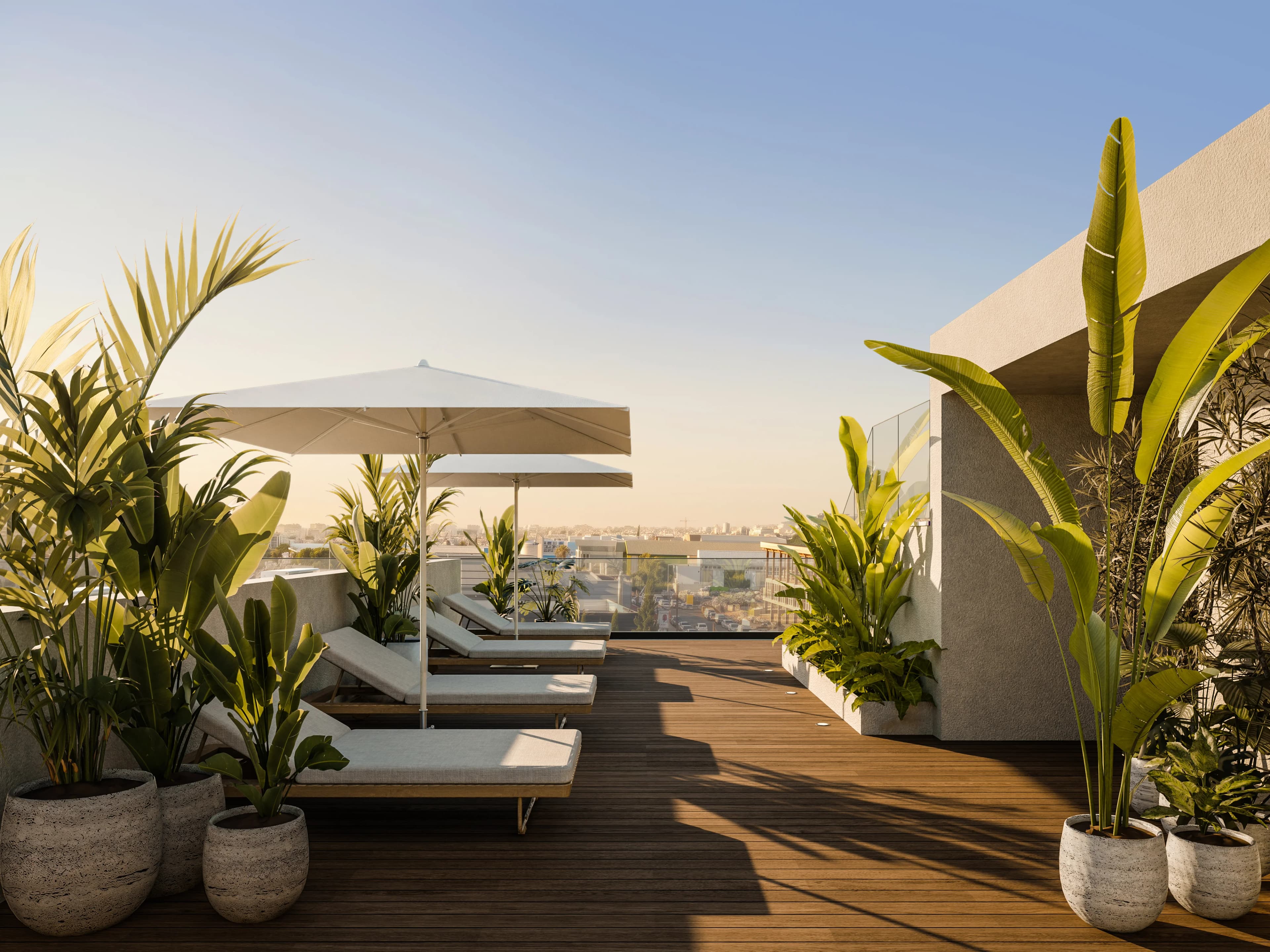 LYNEA's planted roof deck with sun loungers under white parasols