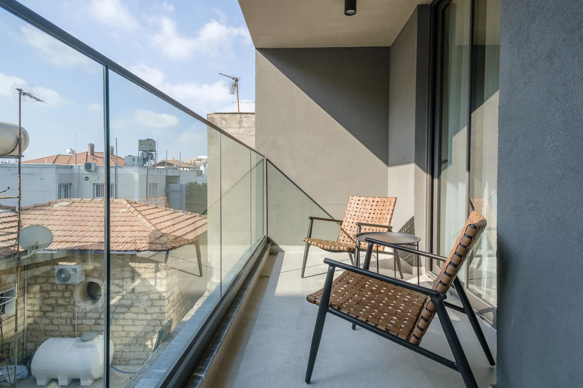 STAY 1 balcony overlooking the tiled rooftops of the Old Town