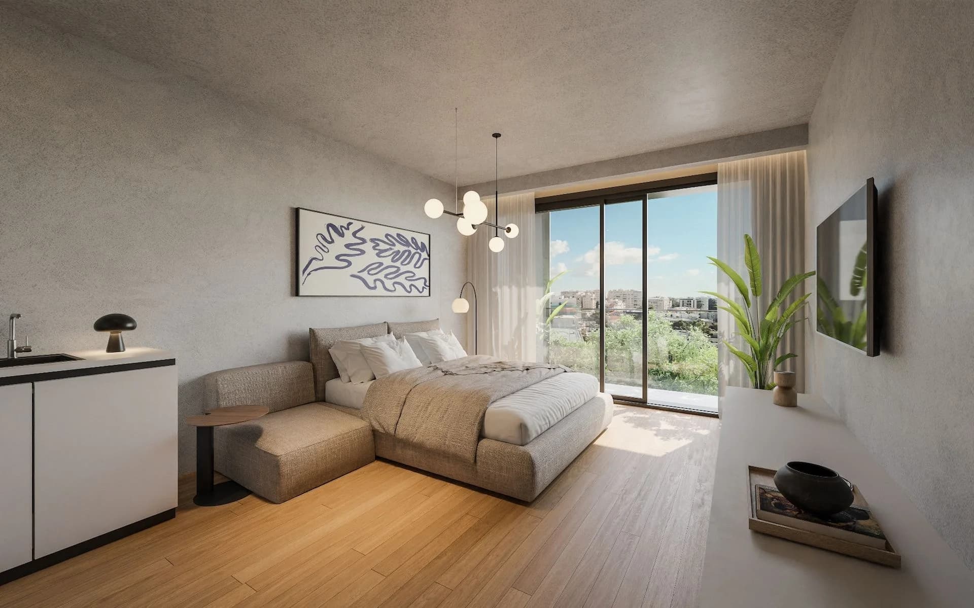 STAY3 studio with a bed, sofa and a glass door onto a balcony