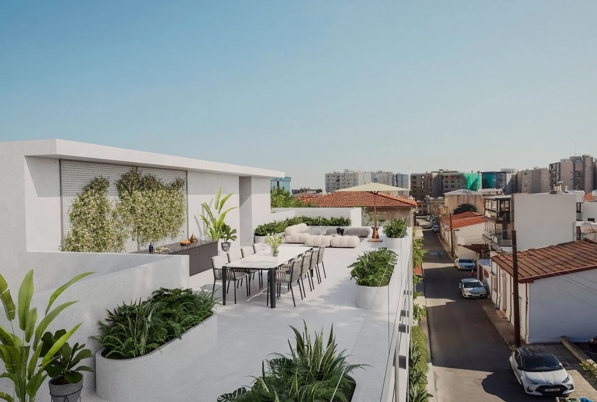 STAY3 roof garden with a dining table, looking over the Historical Centre's rooftops