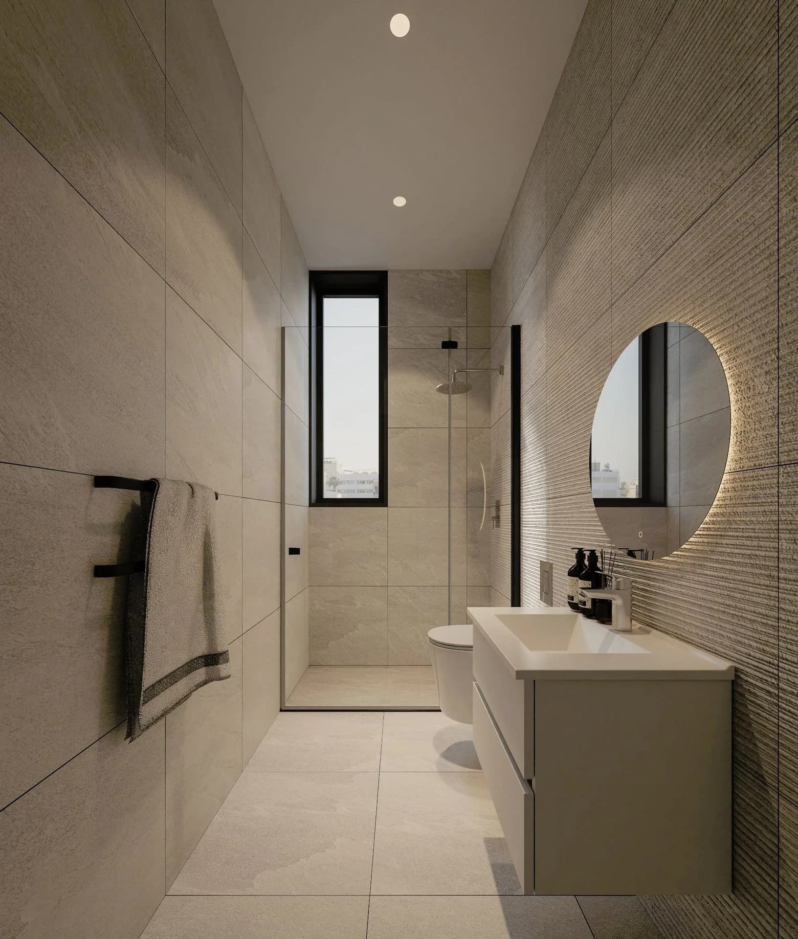 STAY3 shower room with a round backlit mirror and textured tiles