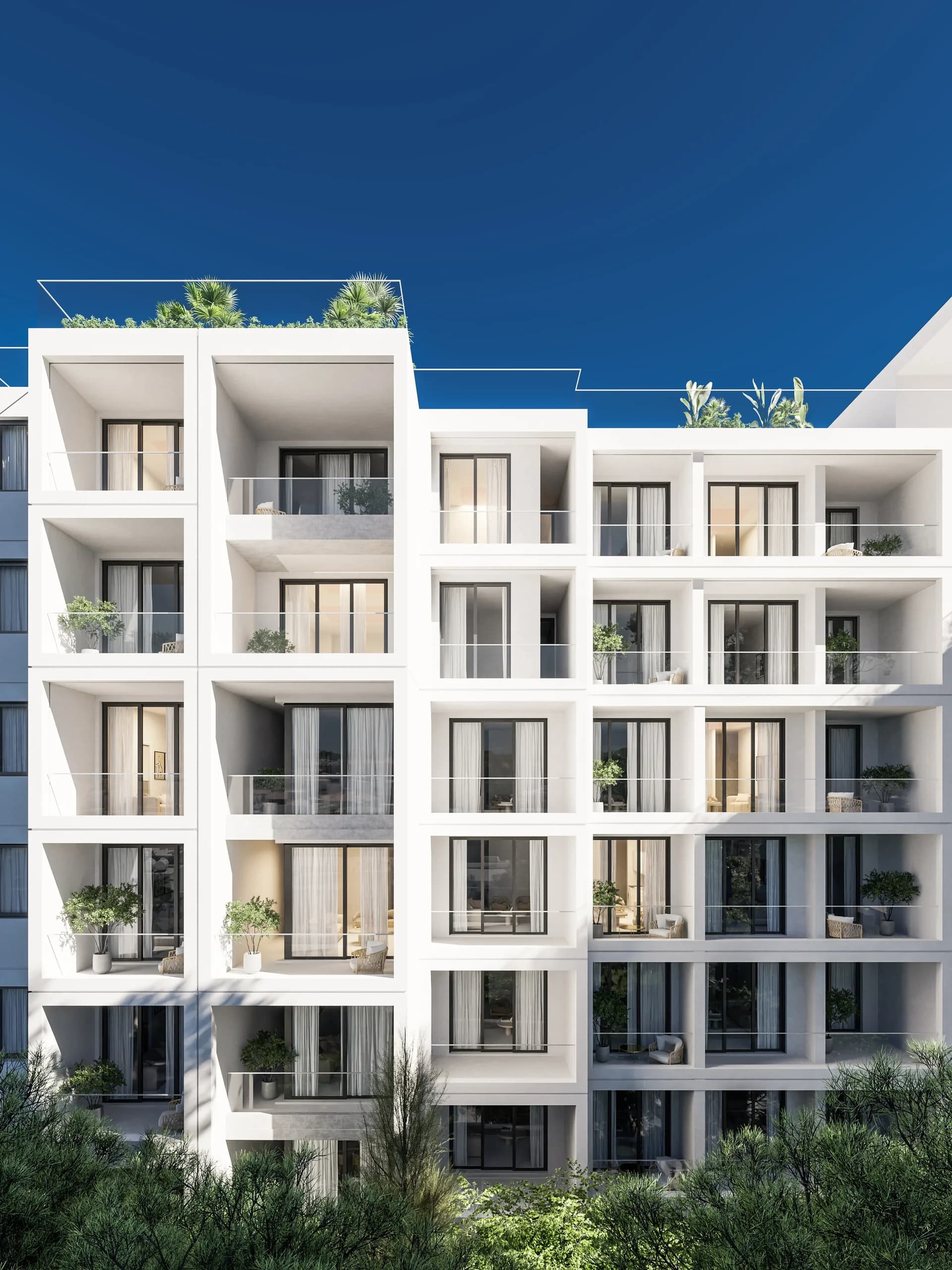 White facade of THE COLLECTION with framed balconies and planted ledges