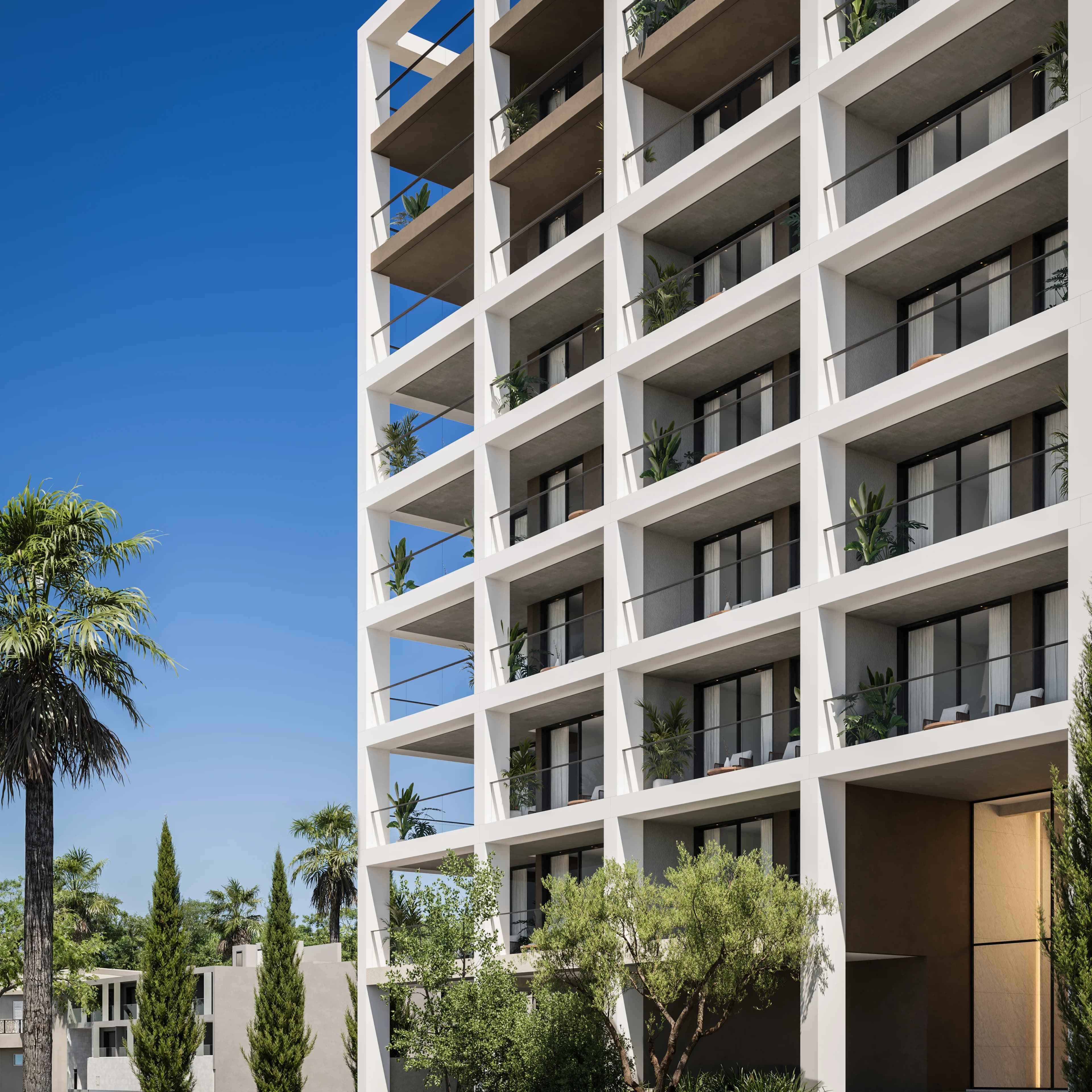 White facade of THE DOCKS with deep balconies and a palm tree