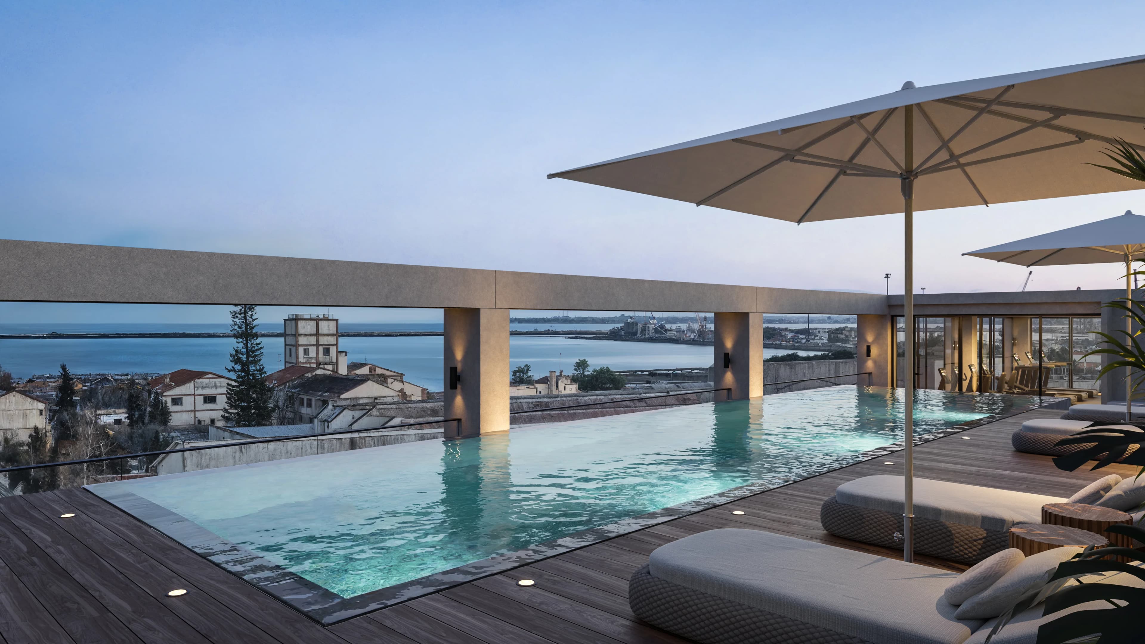 Rooftop pool at THE DOCKS with sun loungers and views over the harbour