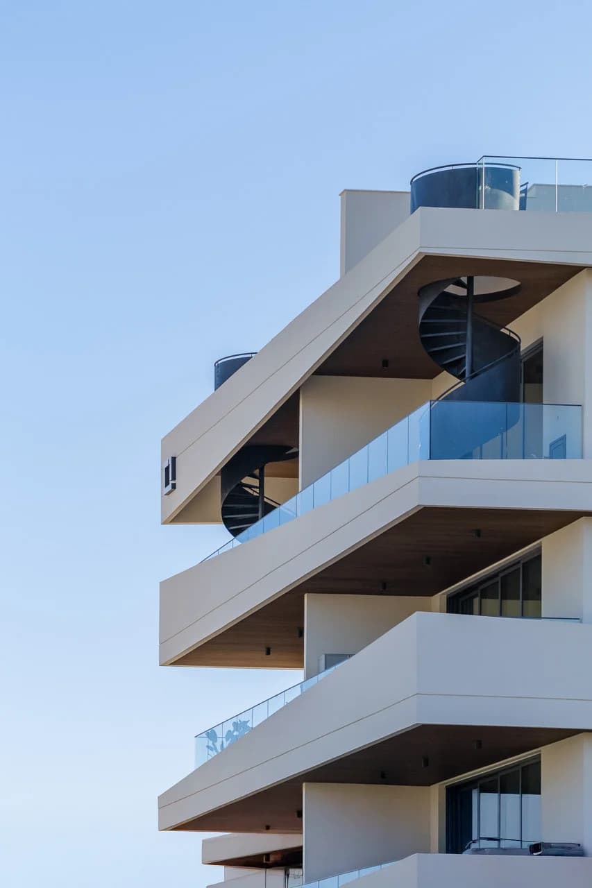 URBN balcony with a black spiral stair up to a private roof garden
