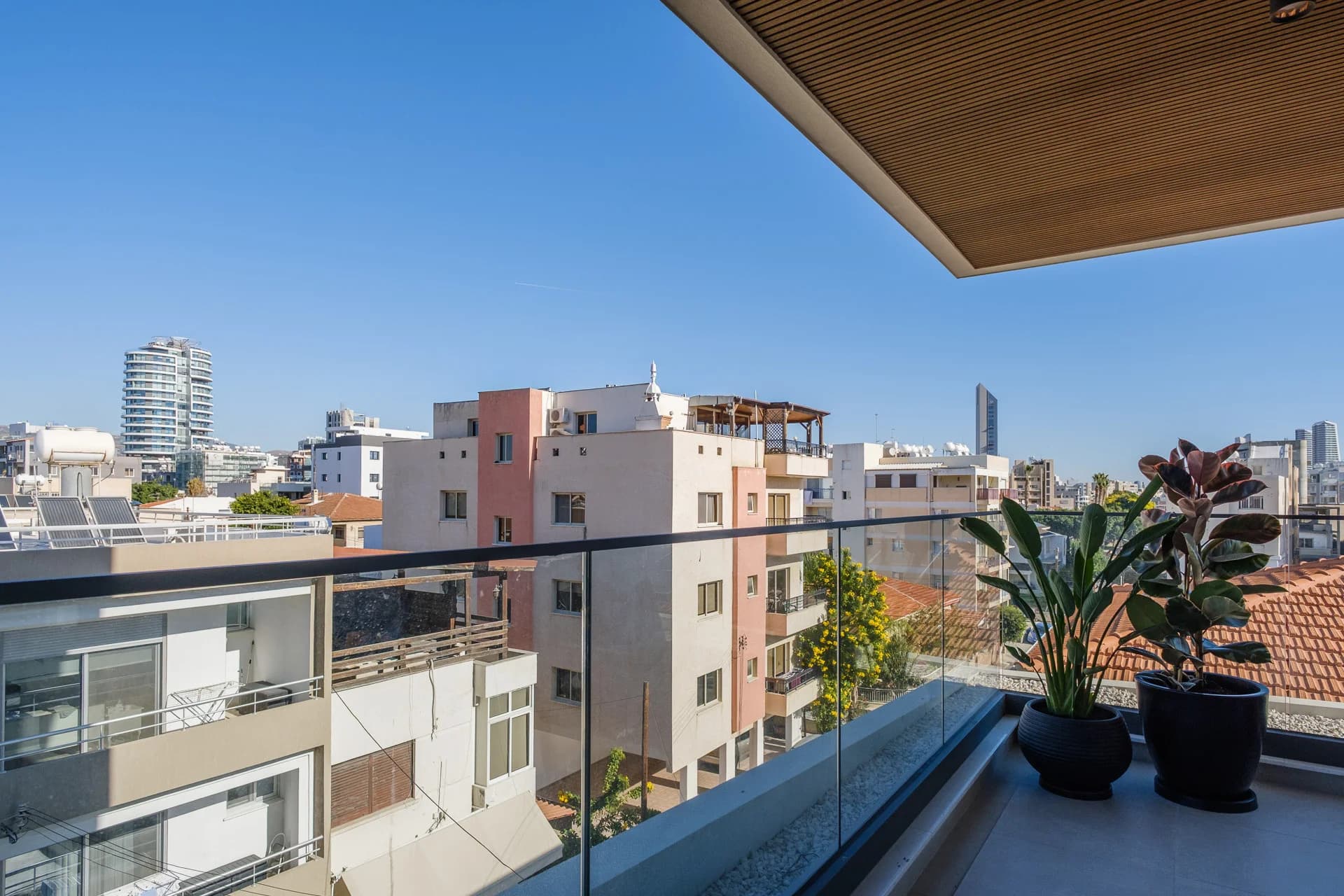 View from an URBN balcony over the rooftops of Agia Zoni to the city's towers