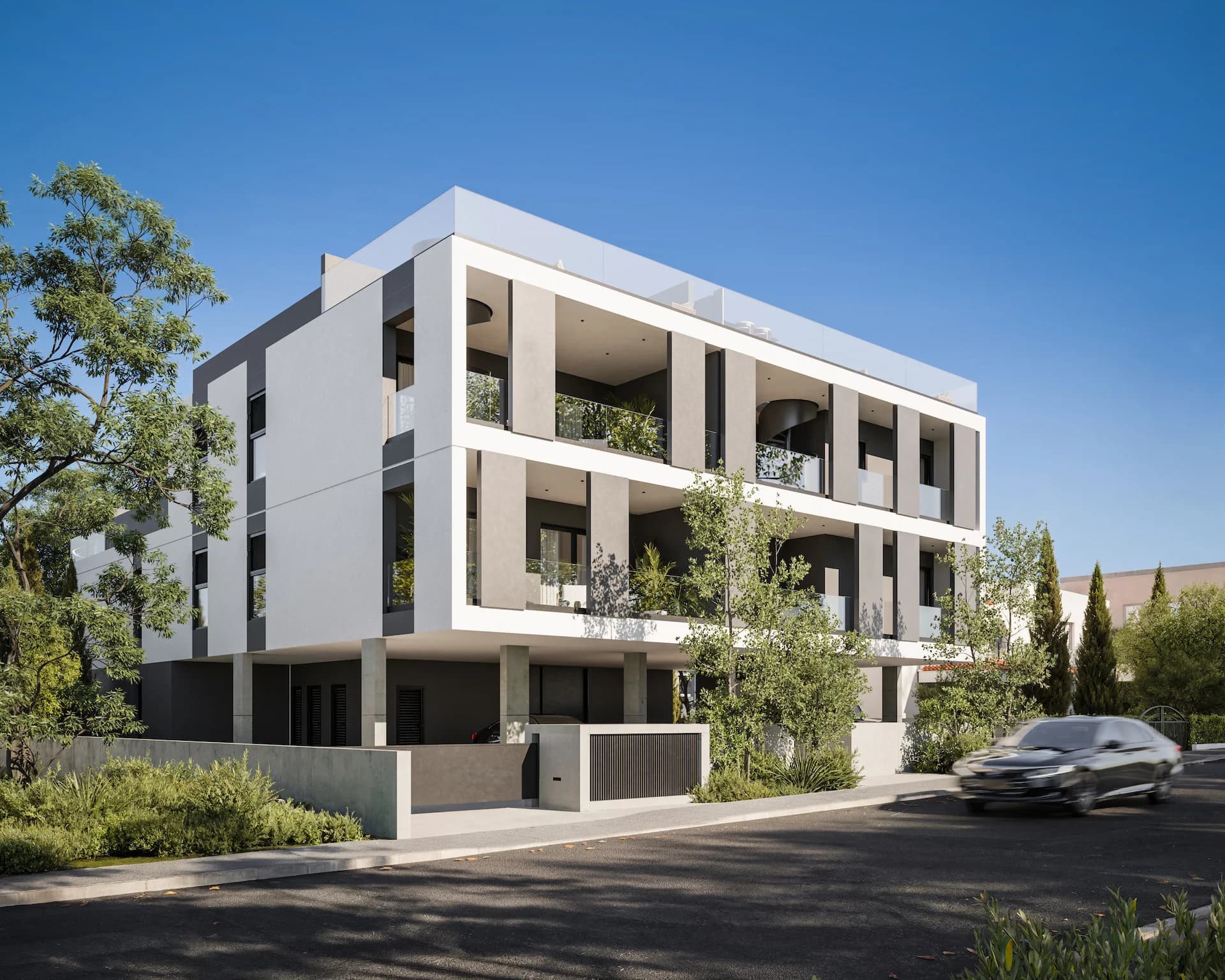 ZAYA's white three-storey block with framed balconies among trees
