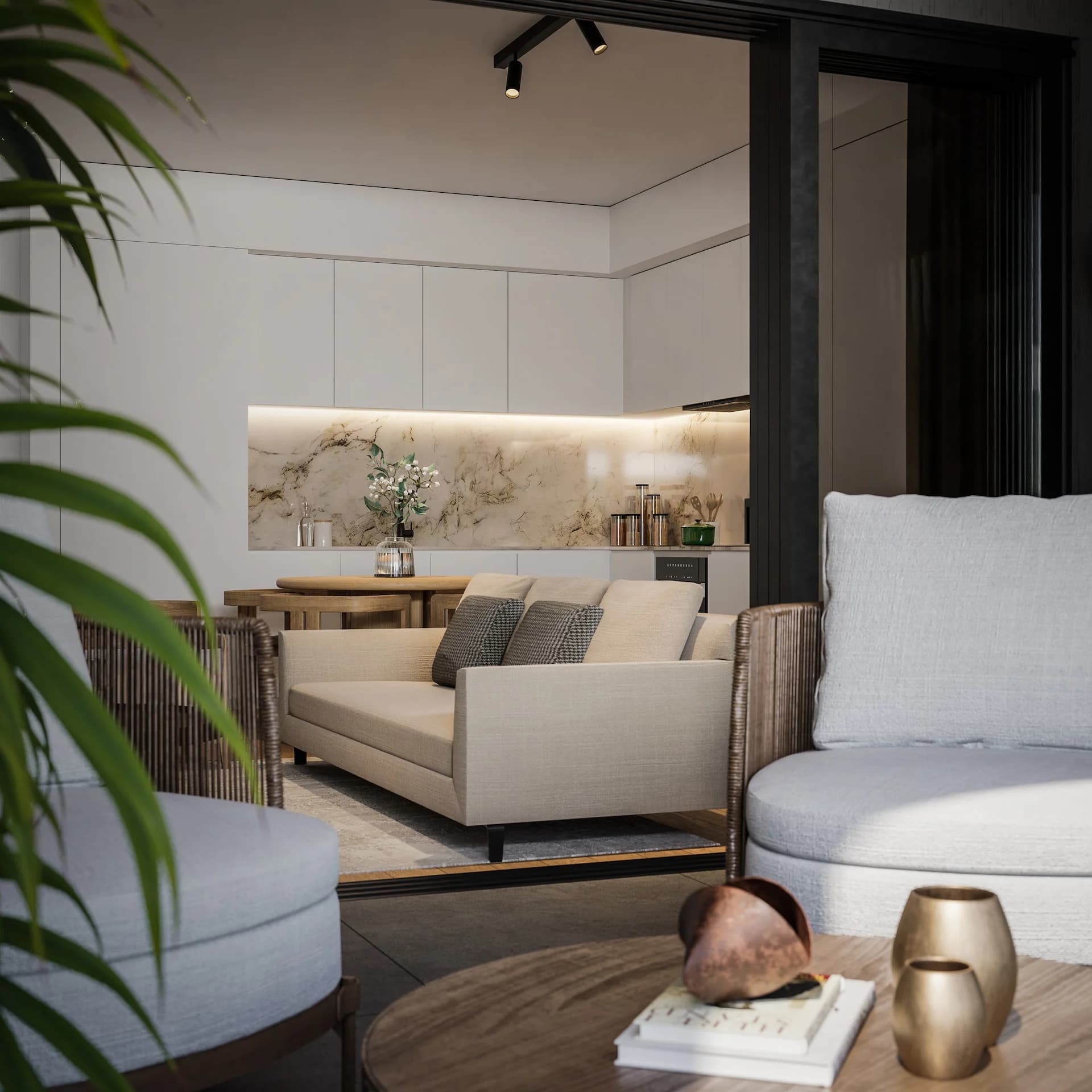 ZAYA living room with a marble-backed kitchen and a curved sofa