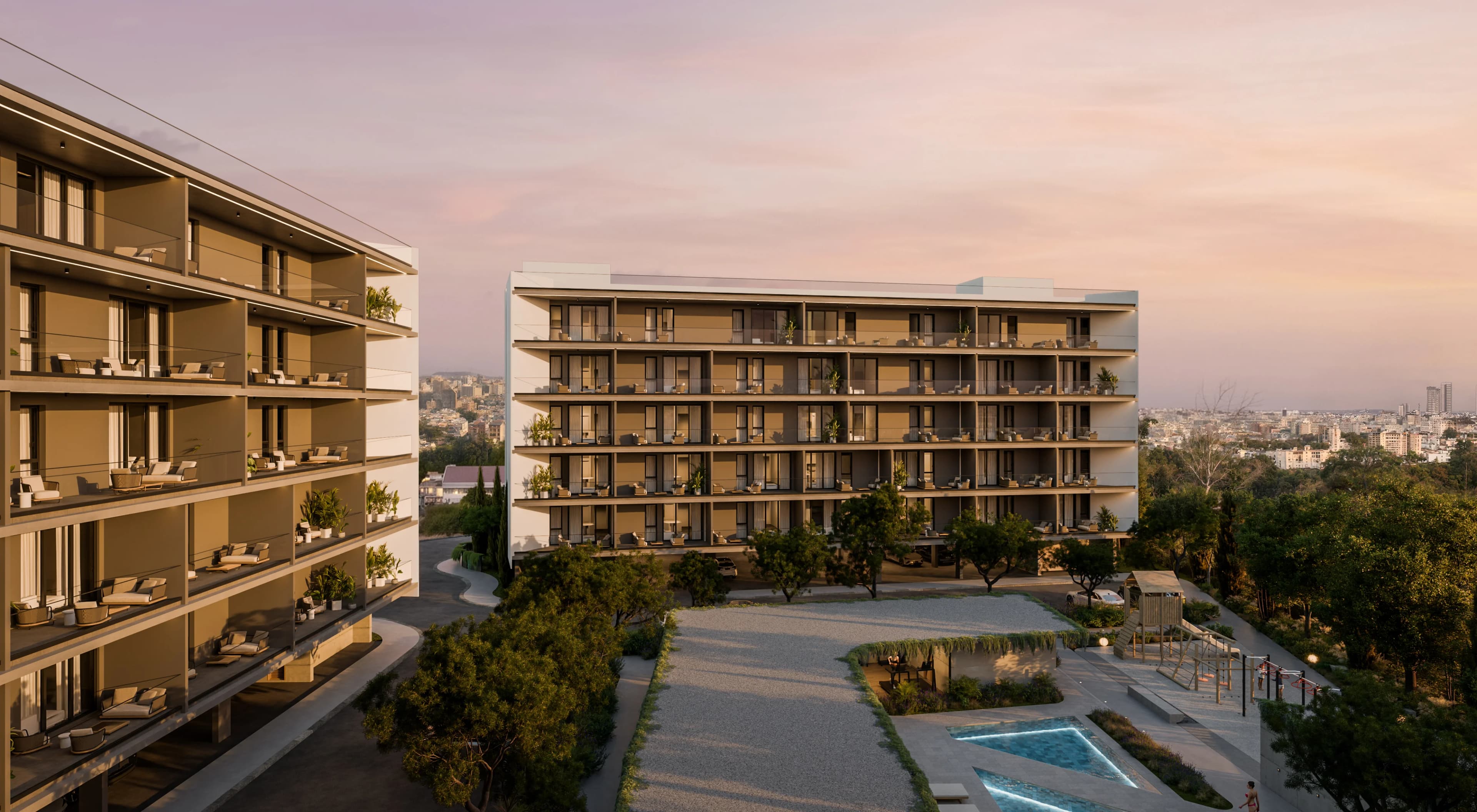 ZOIA's blocks at sunset above the landscaped gardens and pool