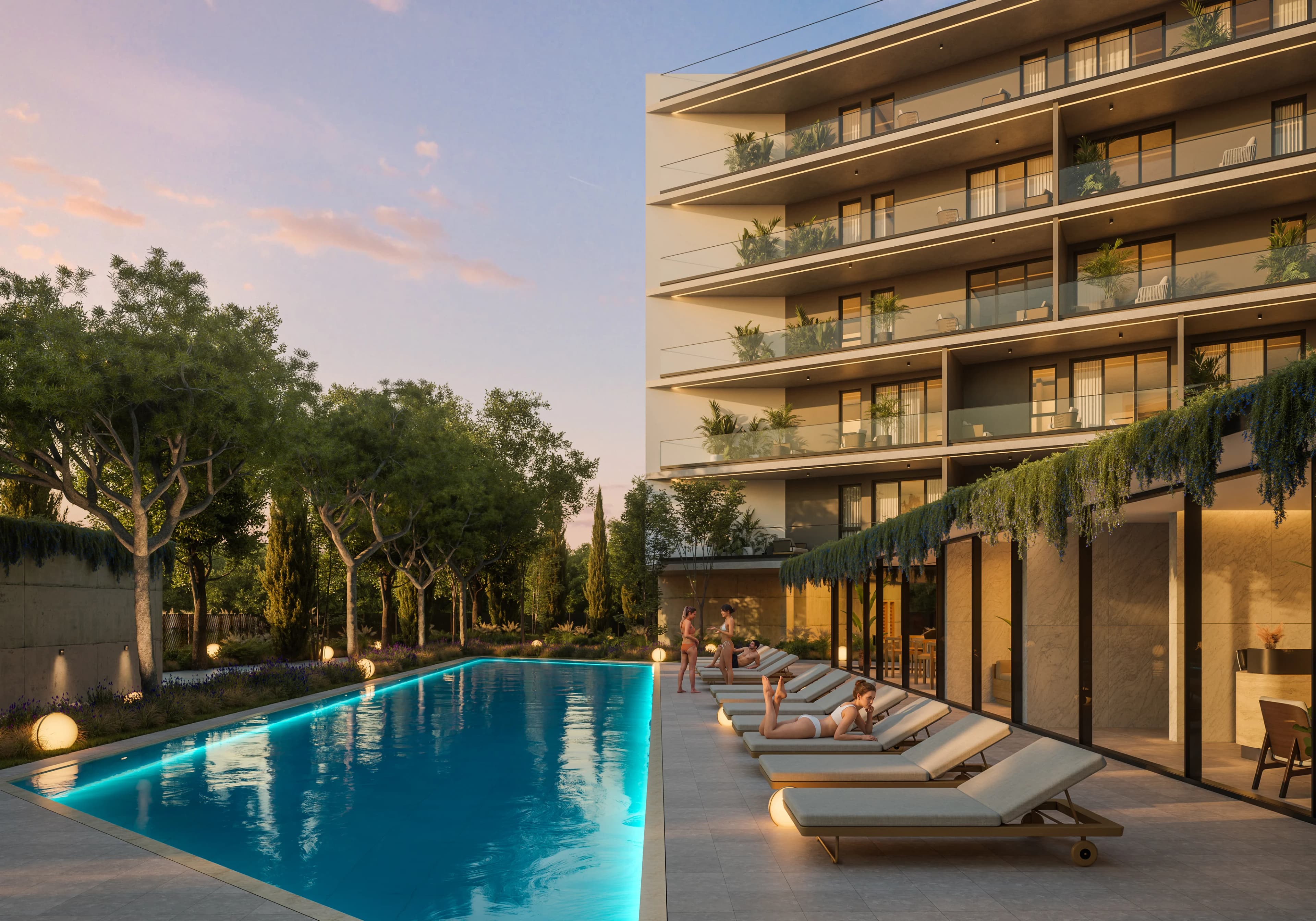 ZOIA's lit swimming pool and sun loungers at dusk