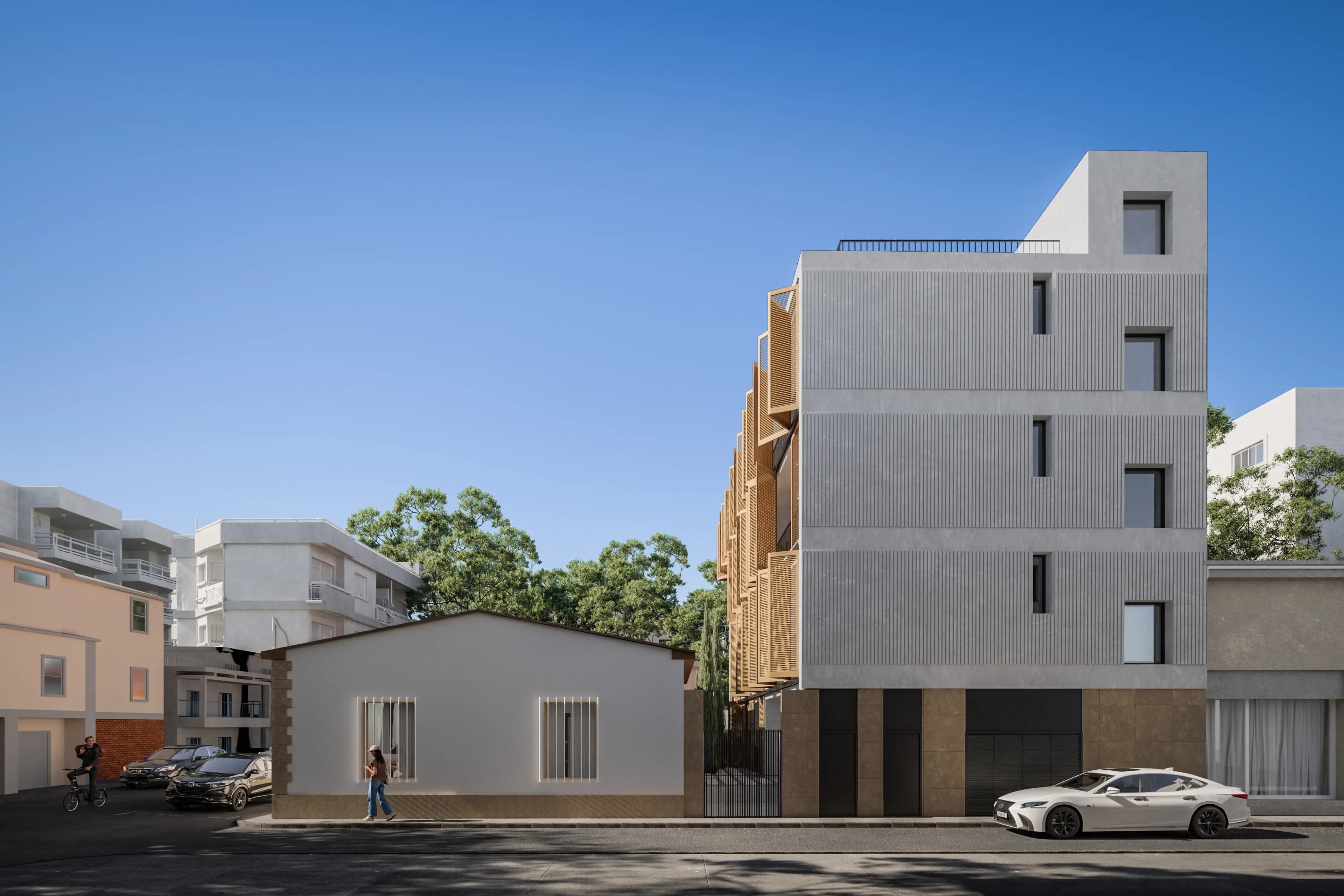 Street view of VIBE among the low houses and trees of Limassol's historic centre