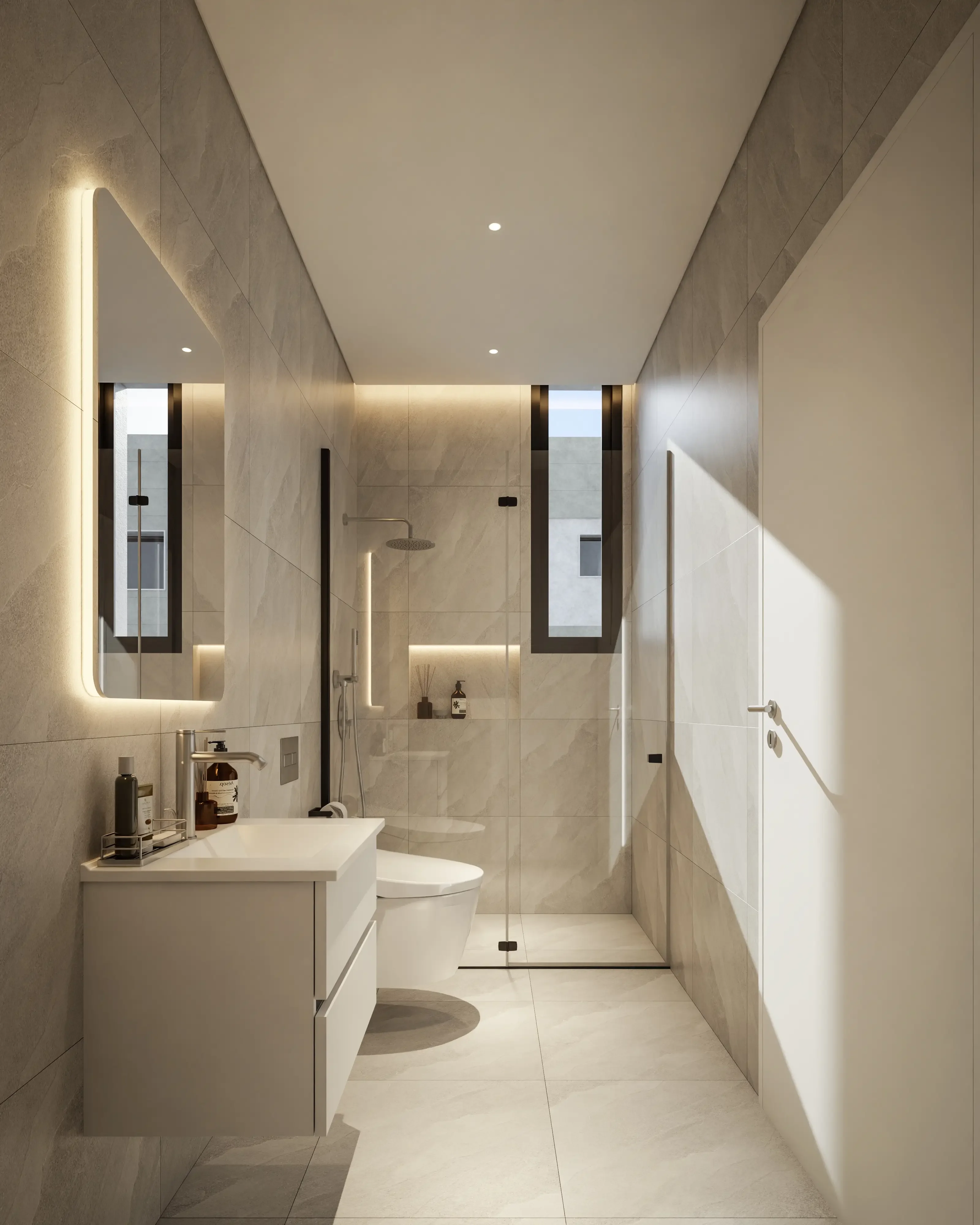Bathroom at VIBE with a stone-look walk-in shower and a backlit mirror